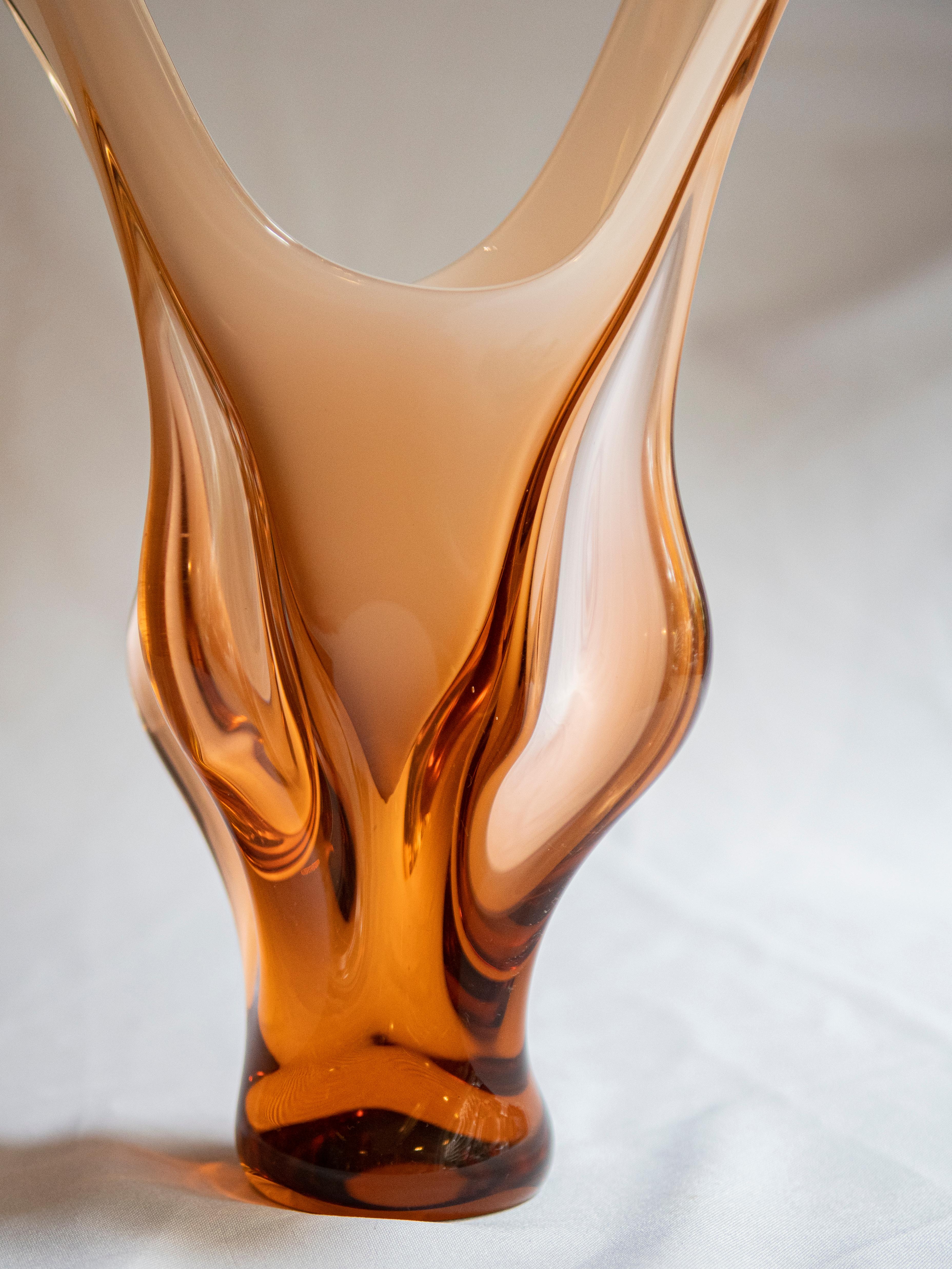 Sculptural hand blown Murano glass centerpiece or vase in a soft peach pink, opaline white and orange color. Italy, 1960s.
  