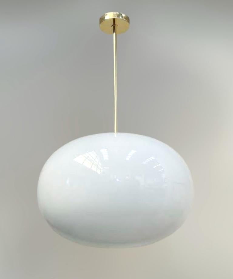 Italian pendant with a large glossy white Murano pebble glass shade mounted on brass frame / designed by Fabio Bergomi for Fabio Ltd / Made in Italy
Measures: Diameter 23.5 inches, height 35.5 inches including rod and canopy
1 light / E26 or E27