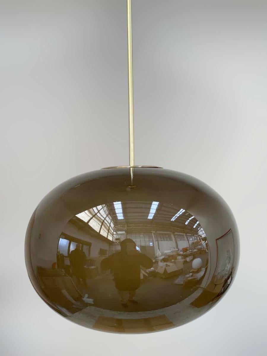 Italian pendant with a large dark frosted smoky Murano pebble glass shade mounted on brass frame / designed by Fabio Bergomi for Fabio Ltd / Made in Italy
Measures: Diameter 23.5 inches, height 35.5 inches including rod and canopy
1 light / E26 or