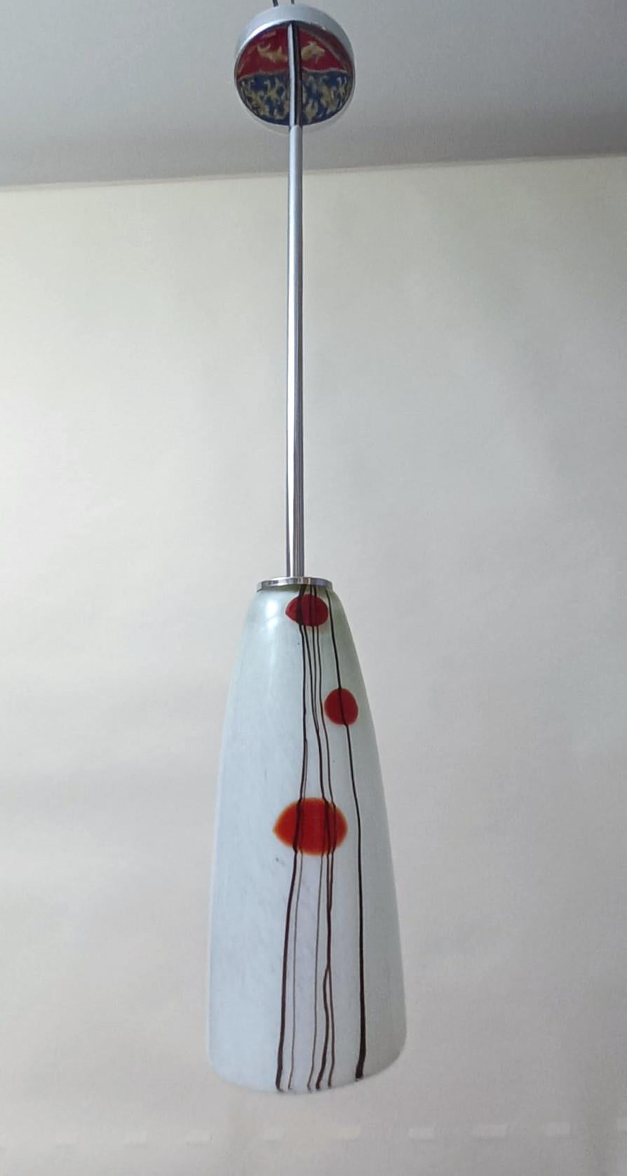Vintage Italian pendant with cone shaped Murano glass shade, mounted on chrome stem / Made in Italy, circa 1960s
Measures: Diameter 4.5 inches, height 10 inches, total height 31 inches including rod and canopy
1 light / E12 or E14 type / max