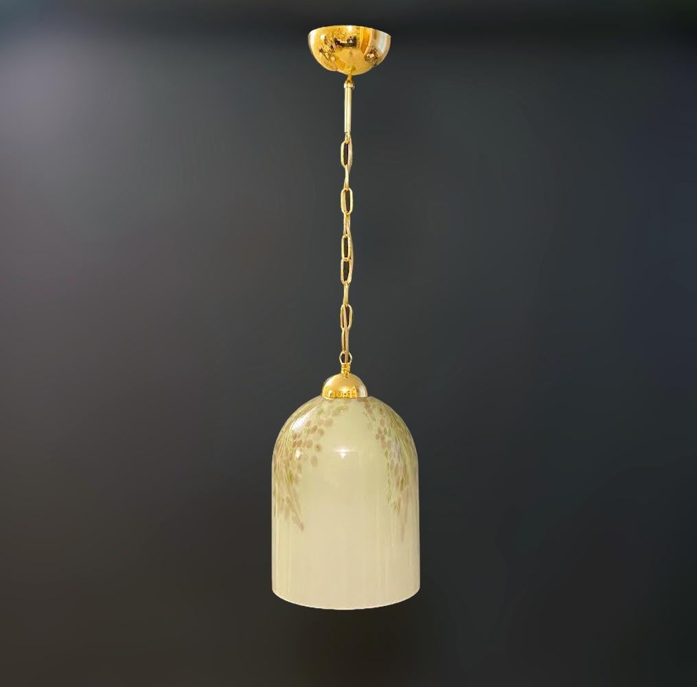 Vintage Italian pendant with bell shaped Murano glass shade, mounted on gold hardware / Made in Italy by La Murrina, circa 1960s
Original mark on the glass
Measures: Diameter 9.5 inches, height 14.5 inches plus chain and canopy
1 light / E26 or E27