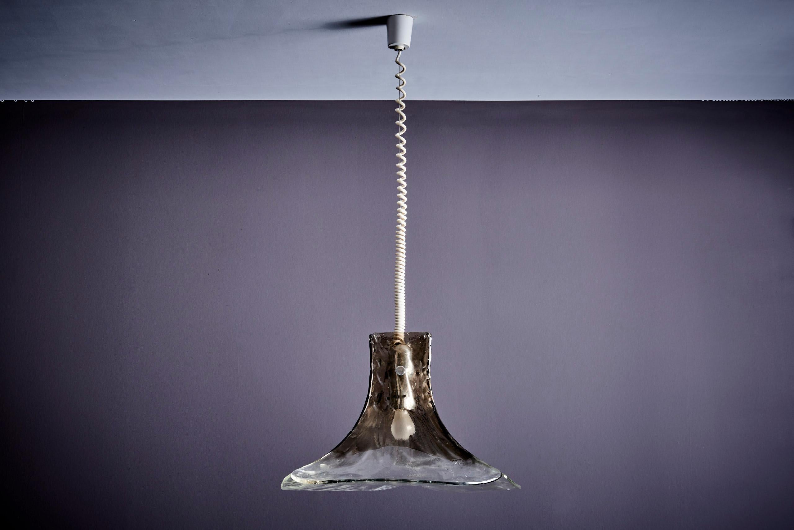 
Introducing an exquisite piece of Italian craftsmanship, the Murano pendant lamp designed by Carlo Nason for Mazzega in the 1960s is a perfect blend of timeless design and high-quality materials, making it a standout addition to any interior.
The