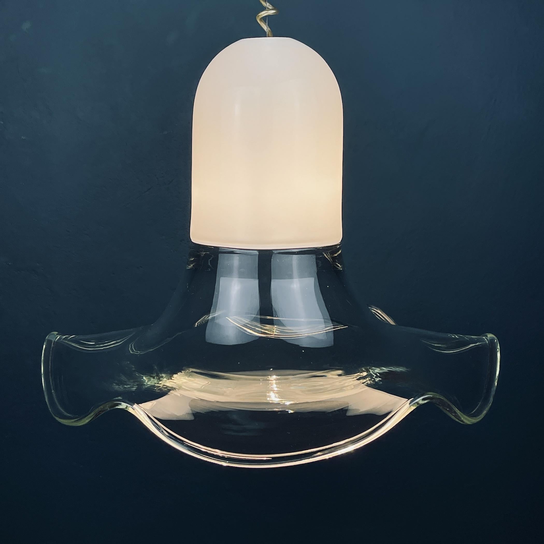 Unusually beautiful murano glass chandelier by Roberto Pamio & Renato Toso for Leucos made in Italy in the 70s. Elegant and graceful, the chandelier seems to float in the air. Perfect vintage condition. No chips or cracks. Requires a standard Edison