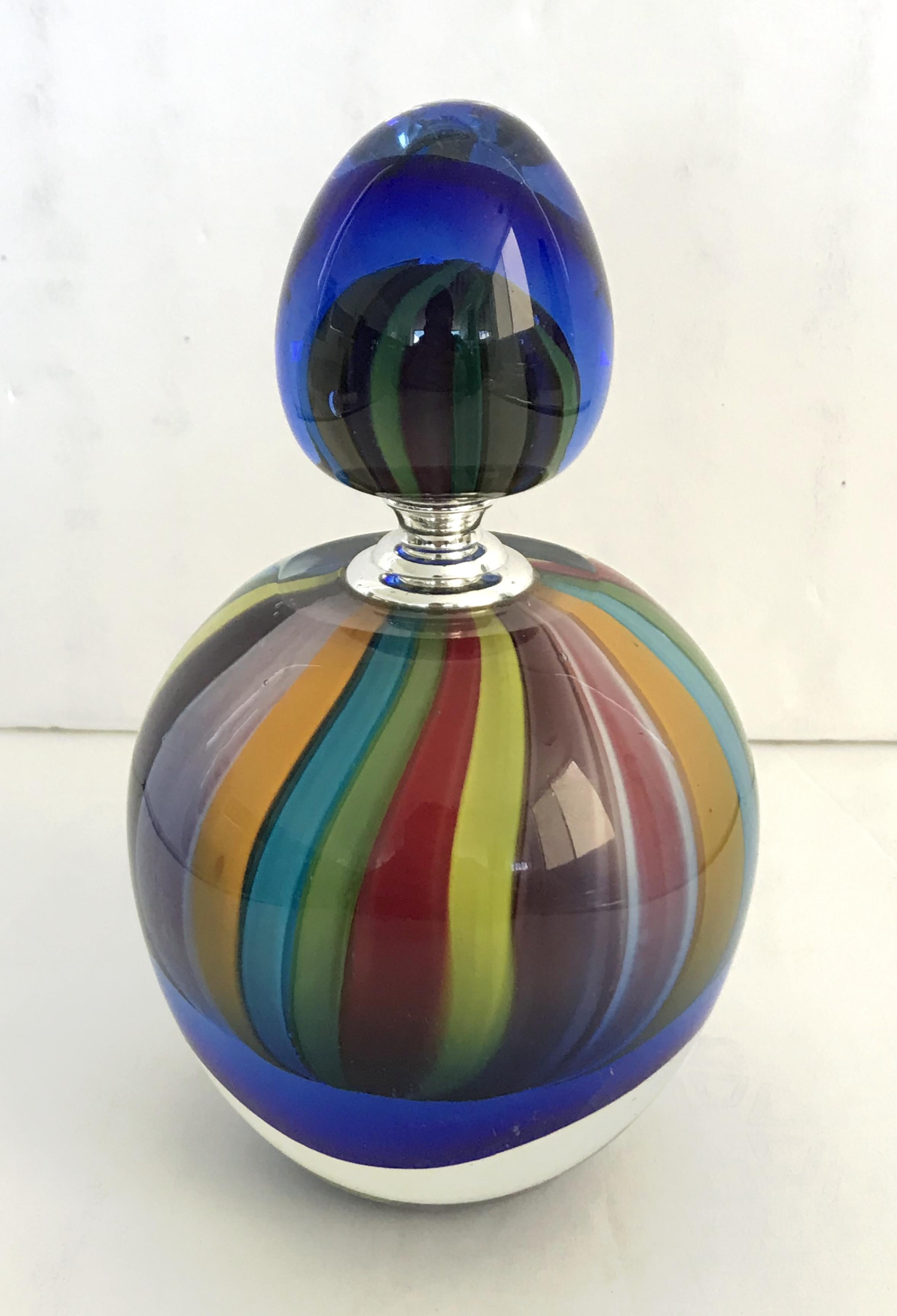Vintage Italian perfume bottle with its original glass stopper, hand blown Murano glass in rainbow color spectrum, made in Italy by circa 1970s
Measures: diameter 4 inches, total height 7 inches, base height 4 inches, top diameter 2 inches, top