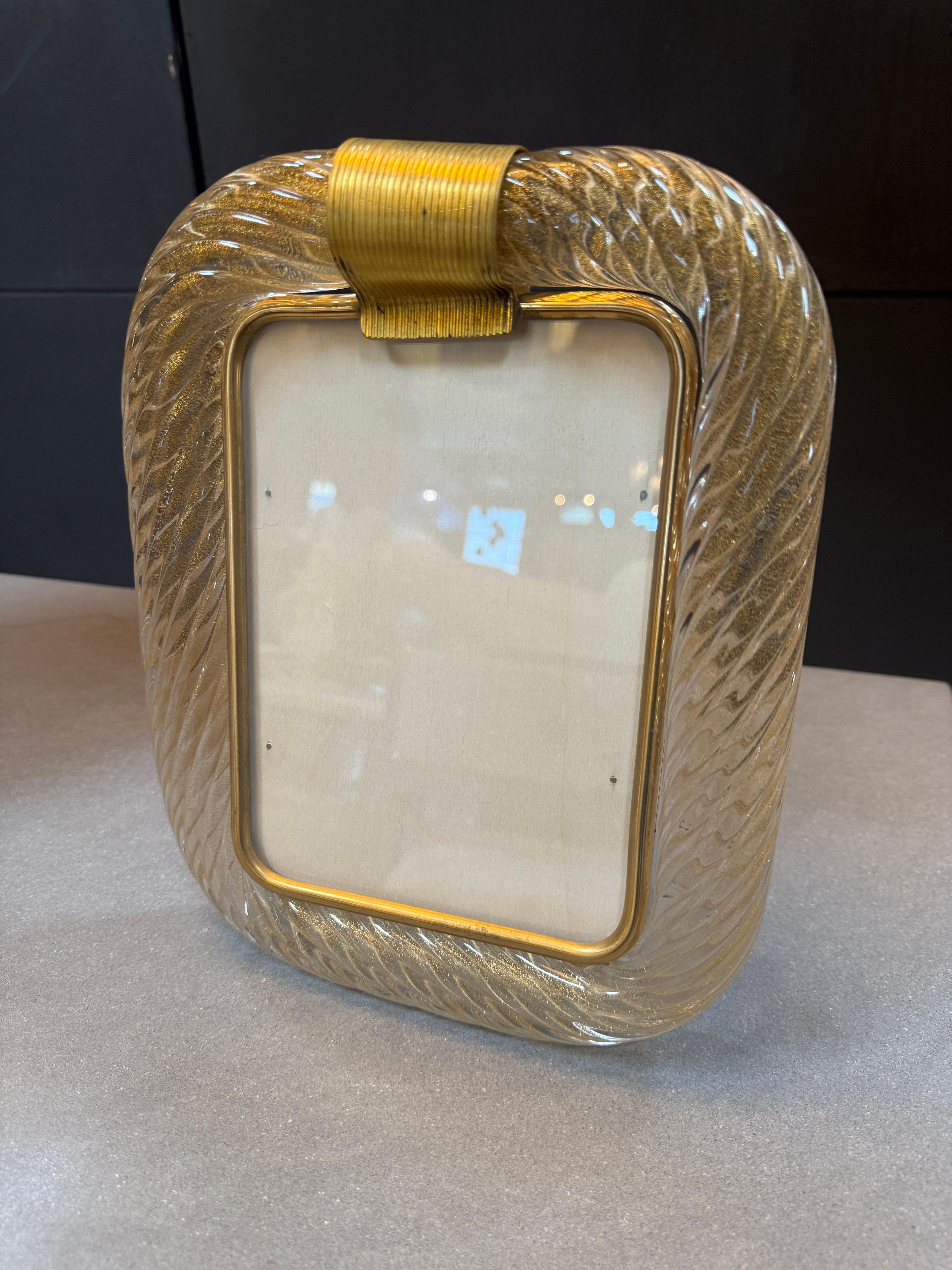 This is a luxurious Italian picture frame, likely from the mid-20th century, with Murano glass and brass detailing.

The frame body is made of hand-blown Murano glass, featuring a twisted rope-like texture with golden tones and flecks that give it a