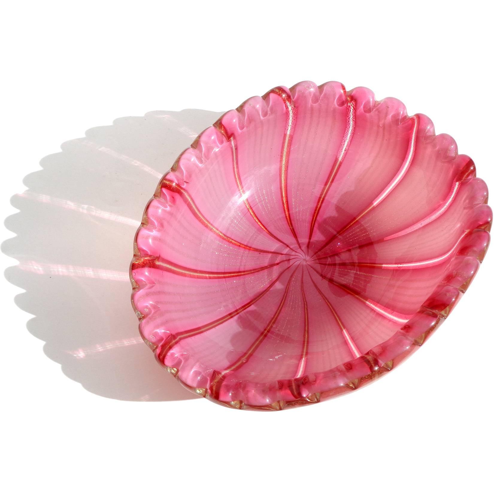 Gorgeous Murano hand blown pink, aventurine and gold flecks Italian art glass decorative bowl. Attributed to Dino Martens for Aureliano Toso. The bowl is made with large 