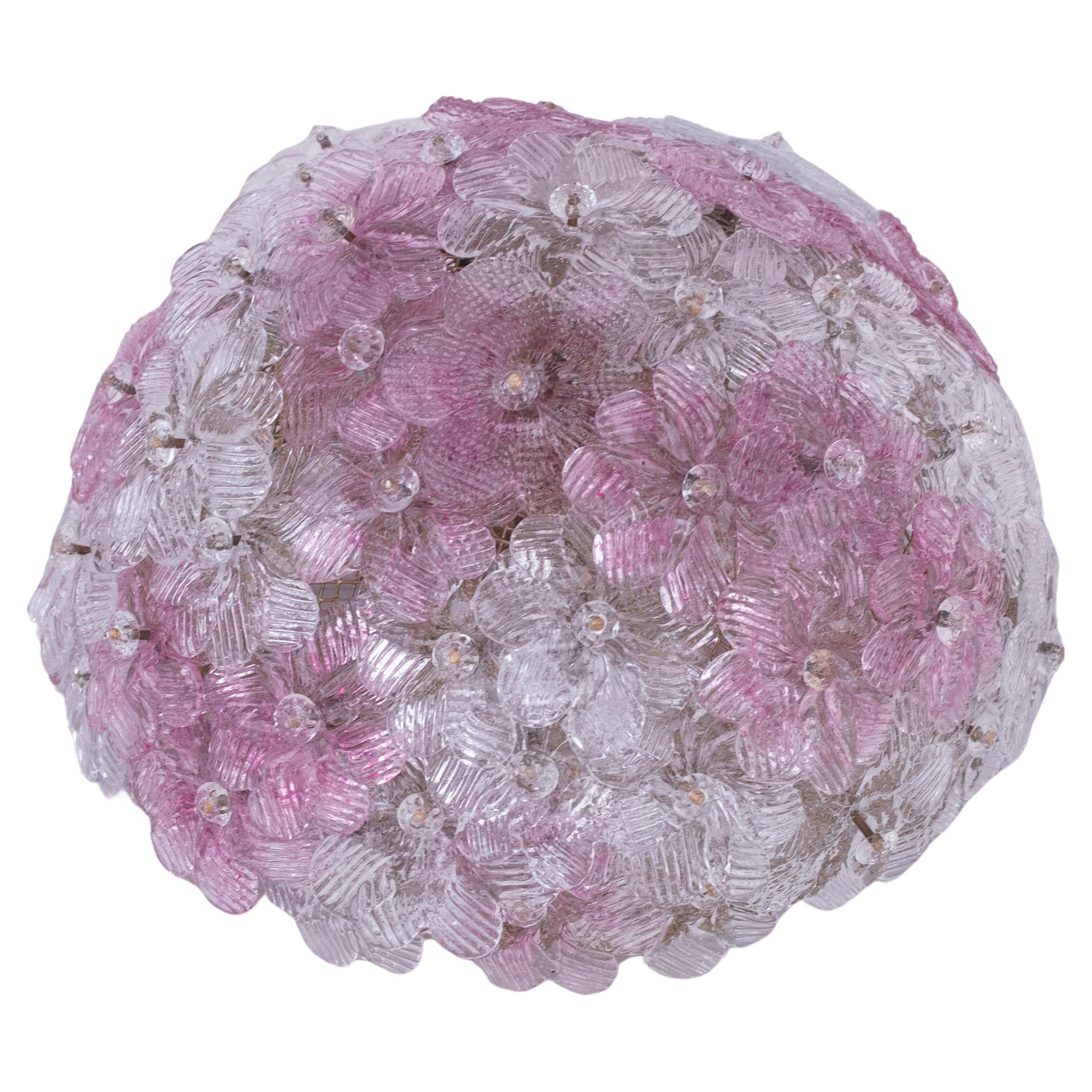 Pretty three-light ceiling lamp with pink and trasparent Murano glass flowers, made by Seguso for Venin, Italy, 1960s.
metal ceiling basket with overlapping flowers made of hand-blown Murano glass in pink and transparent color, attached