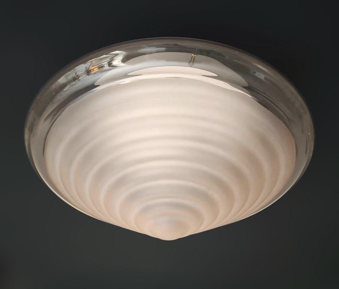 Vintage Italian flush mount or wall light with a single conical satin pink Murano glass shade in ribbed texture / Made in Italy by Mazzega, circa 1960s
Measures: diameter 16 inches, height 7.5 inches
1 light / E26 or E27 type / max 60W
1 available