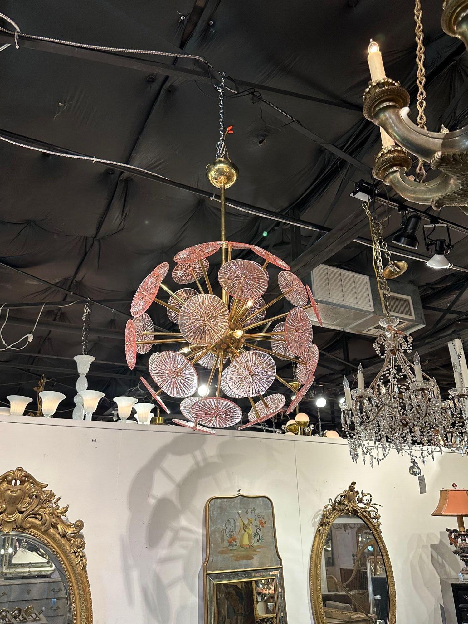 Modern Murano pink glass disc sputnik chandelier with brass frame. Circa 2000. The chandelier has been professionally re-wired, cleaned and is ready to hang. Includes matching chain and canopy.