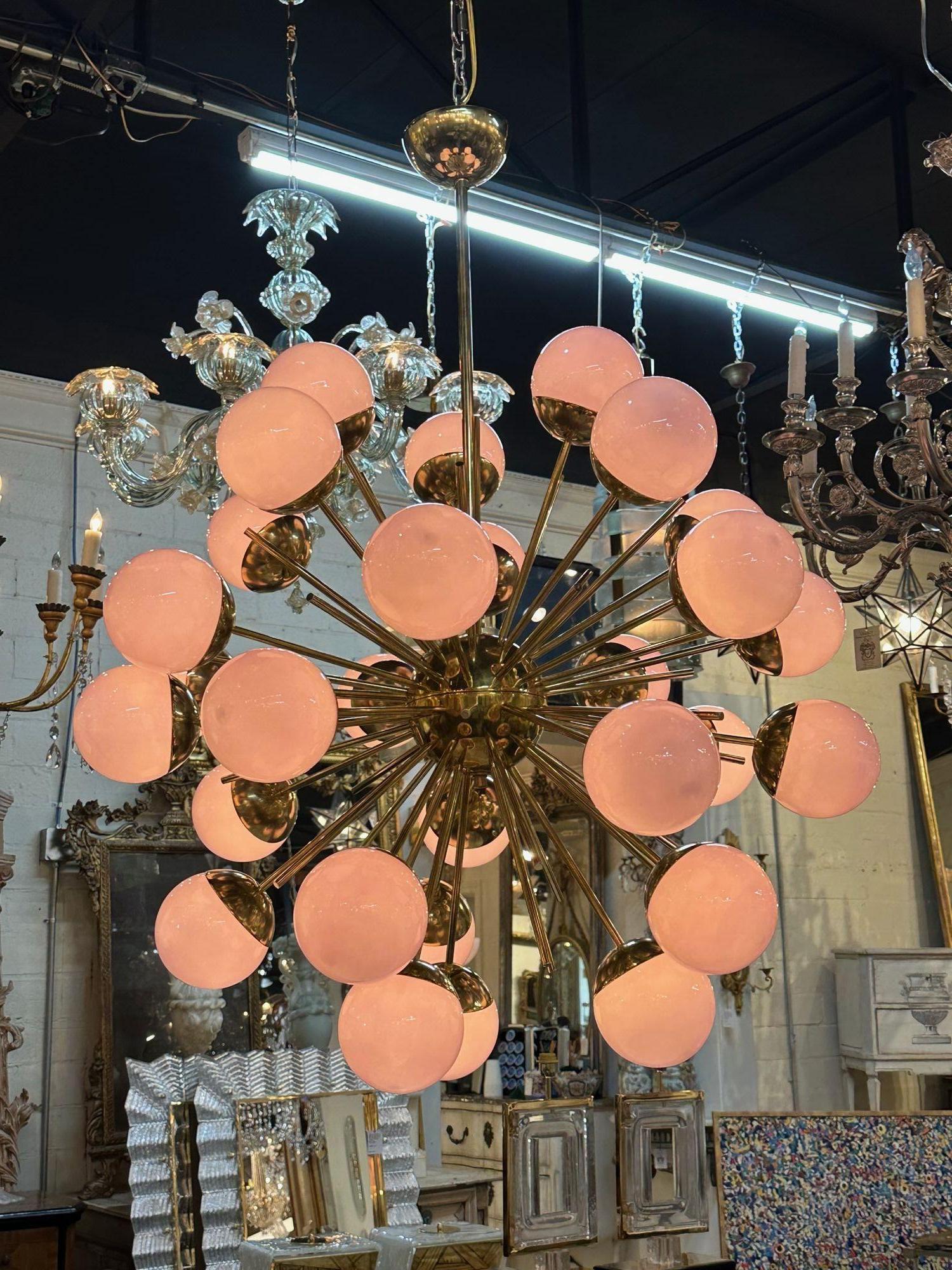 Modern Murano glass and brass pink glass globe sputnik chandelier. Circa 2000. Perfect for today's transitional designs!.