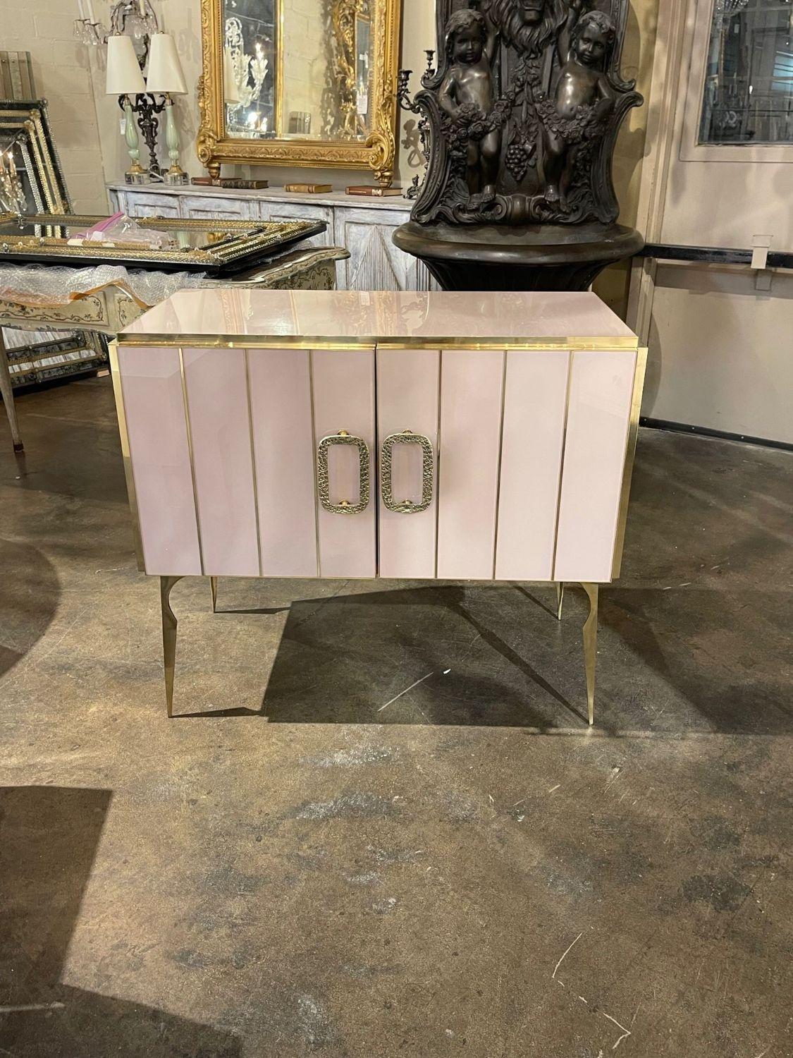 Gorgeous Murano pink glass and polished brass side cabinet. Perfect for today's transitional designs! 