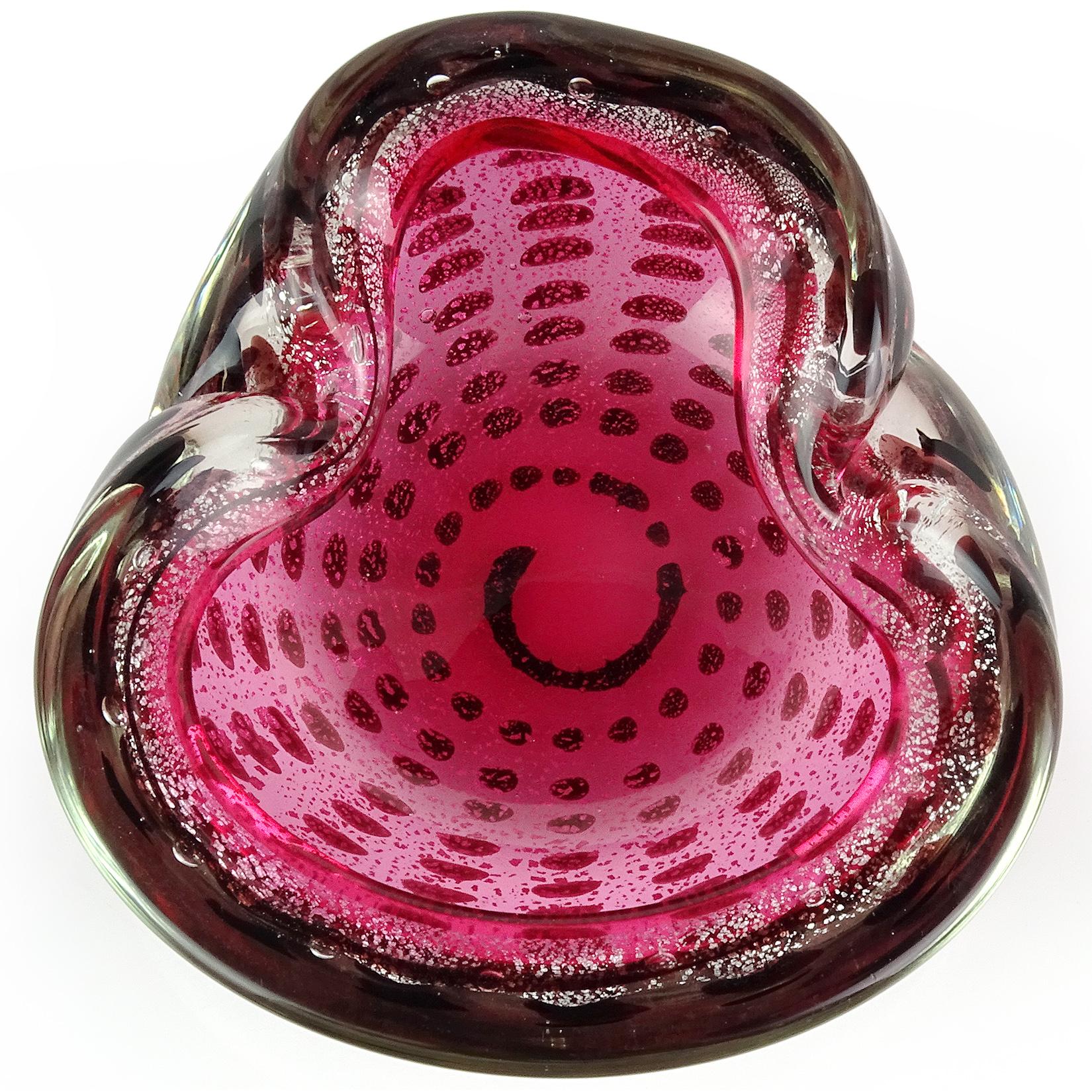 Beautiful vintage Murano hand blown, rich pink with dark spots Italian art glass decorative bowl. The piece has a folded over edge, with decorative indents. It is profusely covered in silver leaf, with rows of dark purple (almost black) spots