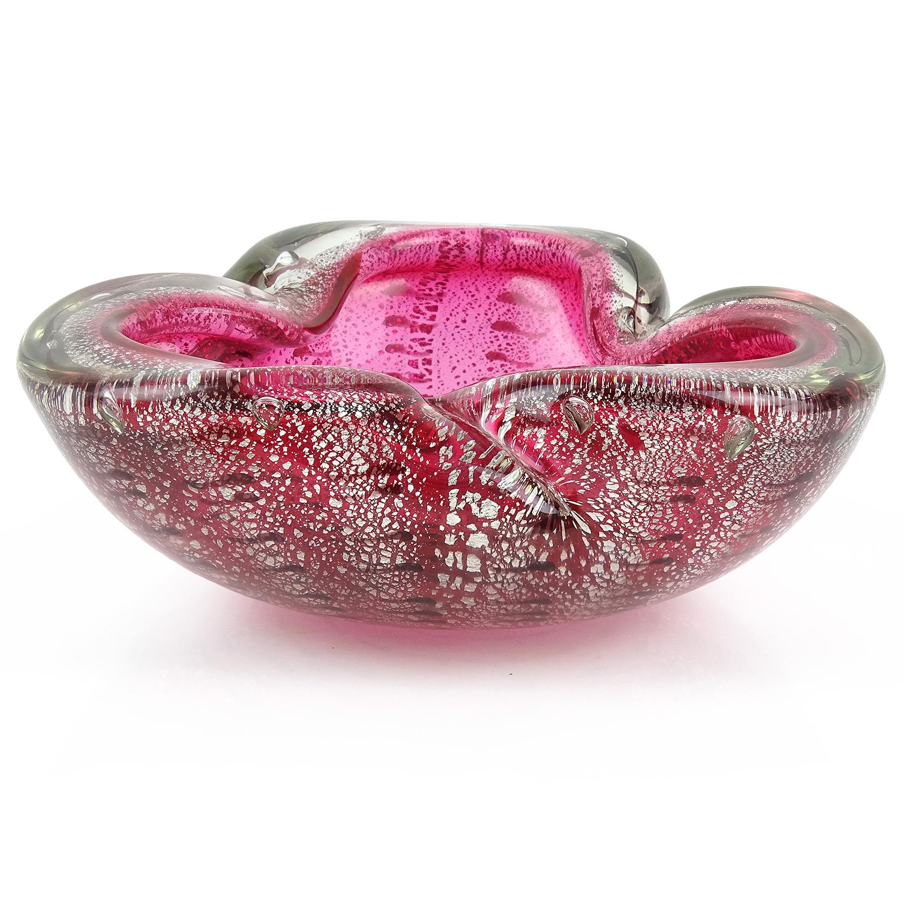 Beautiful vintage Murano hand blown, rich pink with dark spots Italian art glass decorative bowl. The piece has a folded over edge, with decorative indents. It is profusely covered in silver leaf, with rows of dark purple (almost black) spots