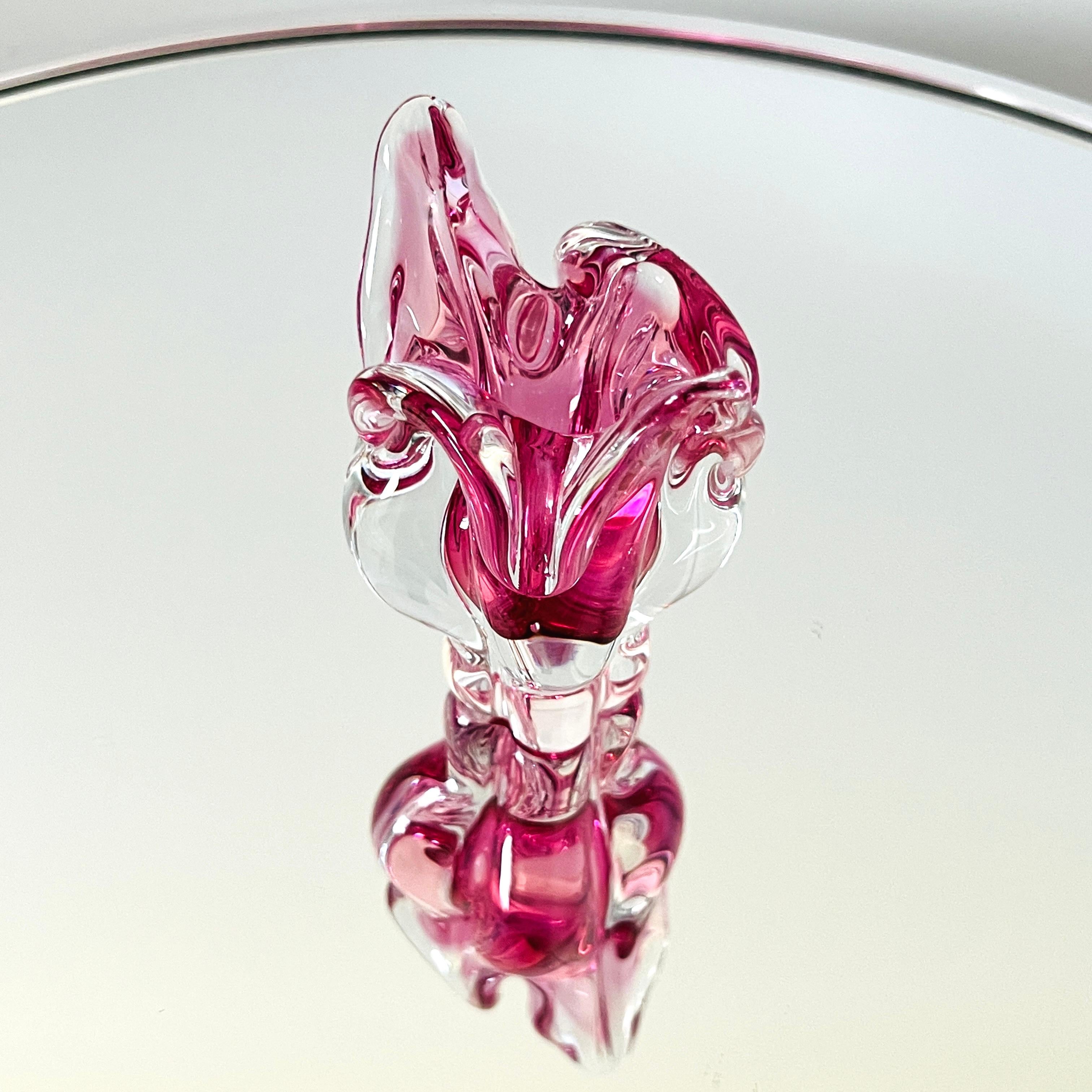Small hand blown Murano glass vase in the shape of a stylized tulip. Beautiful prismatic design capturing light from all angles in hues of violet-pink. Made with Sommerso technique whereby colors are submerged within clear glass. Makes a great