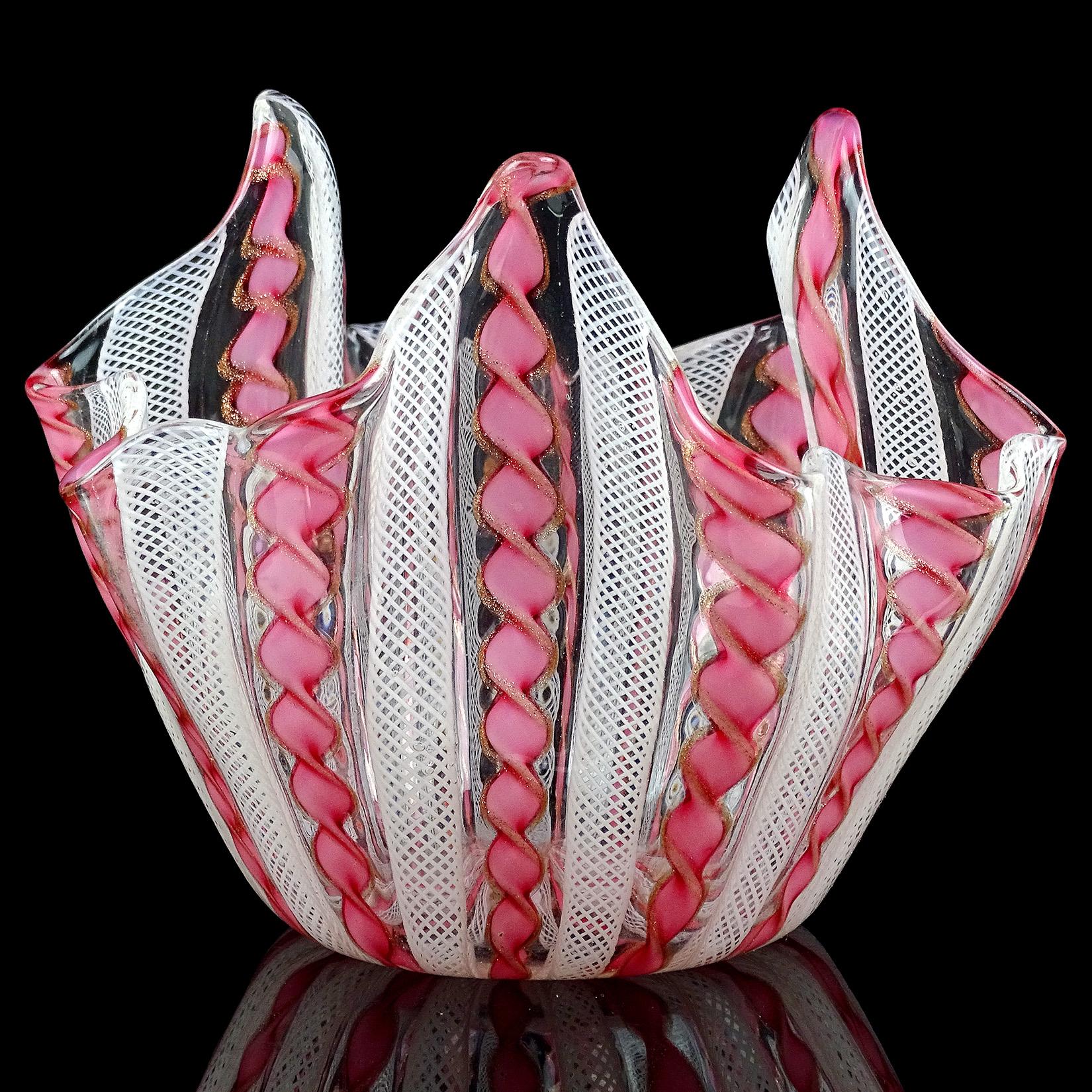 Beautiful vintage Murano hand blown pink, aventurine and white Italian art glass fazzoletto flower vase. Documented to the Fratelli Toso company. The piece is made with twisting pink and copper aventurine fleck Latticino ribbons, and white net