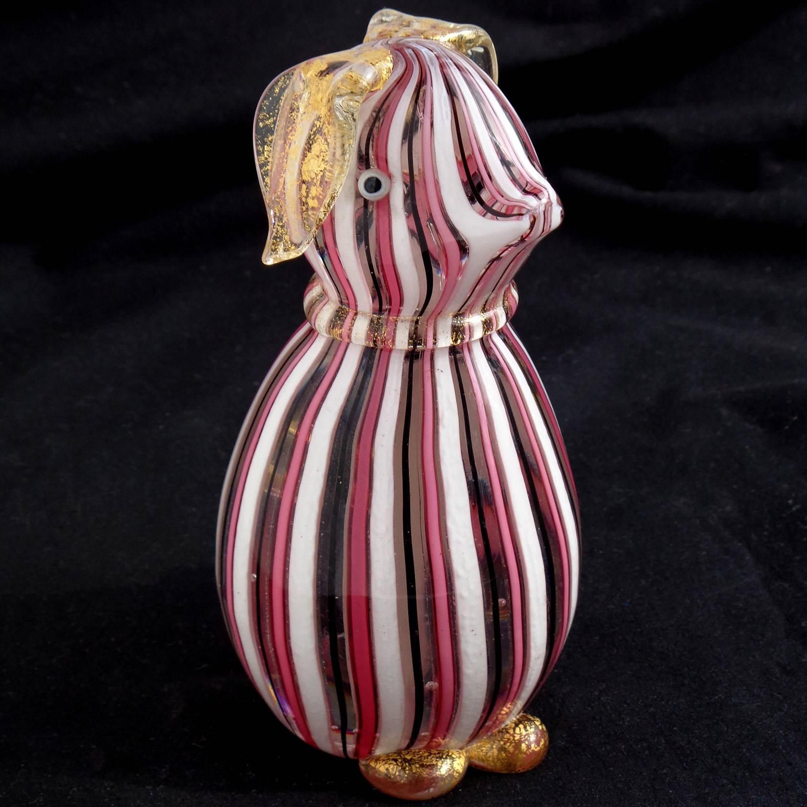 Very cute vintage Murano hand blown pink, white and black ribbons Italian art glass puppy dog figurine / sculpture. Documented to the Fratelli Toso company. The dog has applied floppy ears, collar and tail, all covered in gold leaf. Would make a