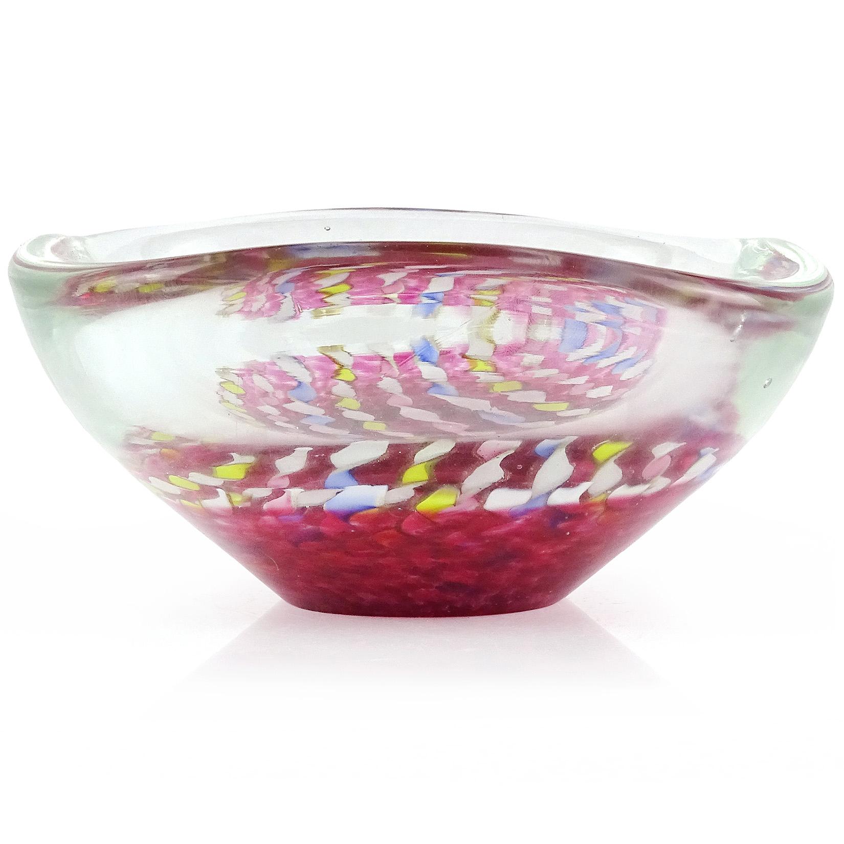 Beautiful vintage Murano hand blown twisted blue, pink, yellow, and aventurine ribbons Italian art glass bowl. The ribbons hover over a bed of fuchsia pink dots. Created in the manner of the Seguso and Fratelli Toso companies. Made with very thick