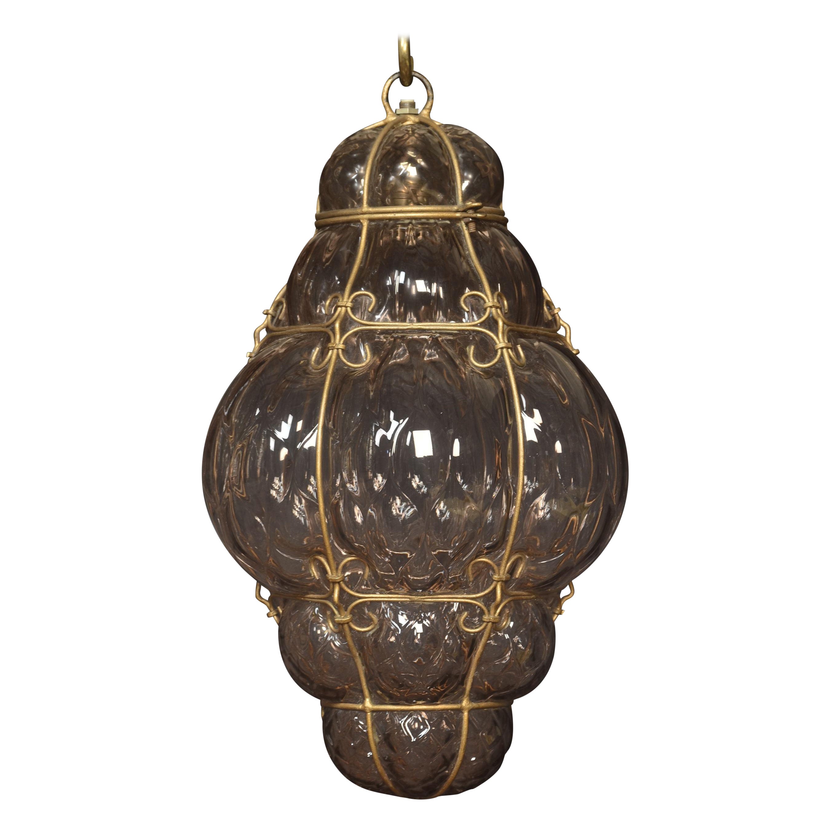 Murano Anhänger aus lila Glas mit Käfig