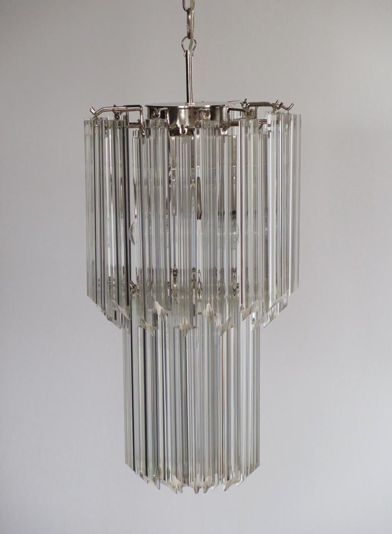 Fantastic vintage Murano chandelier made by 44 Murano trasparent crystal prism in a nickel metal frame.
Period: Late 20th century
Dimensions: 55.10 inches height (140 cm) with chain; 27.50 inches height (70 cm) without chain; 12.6 inches diameter