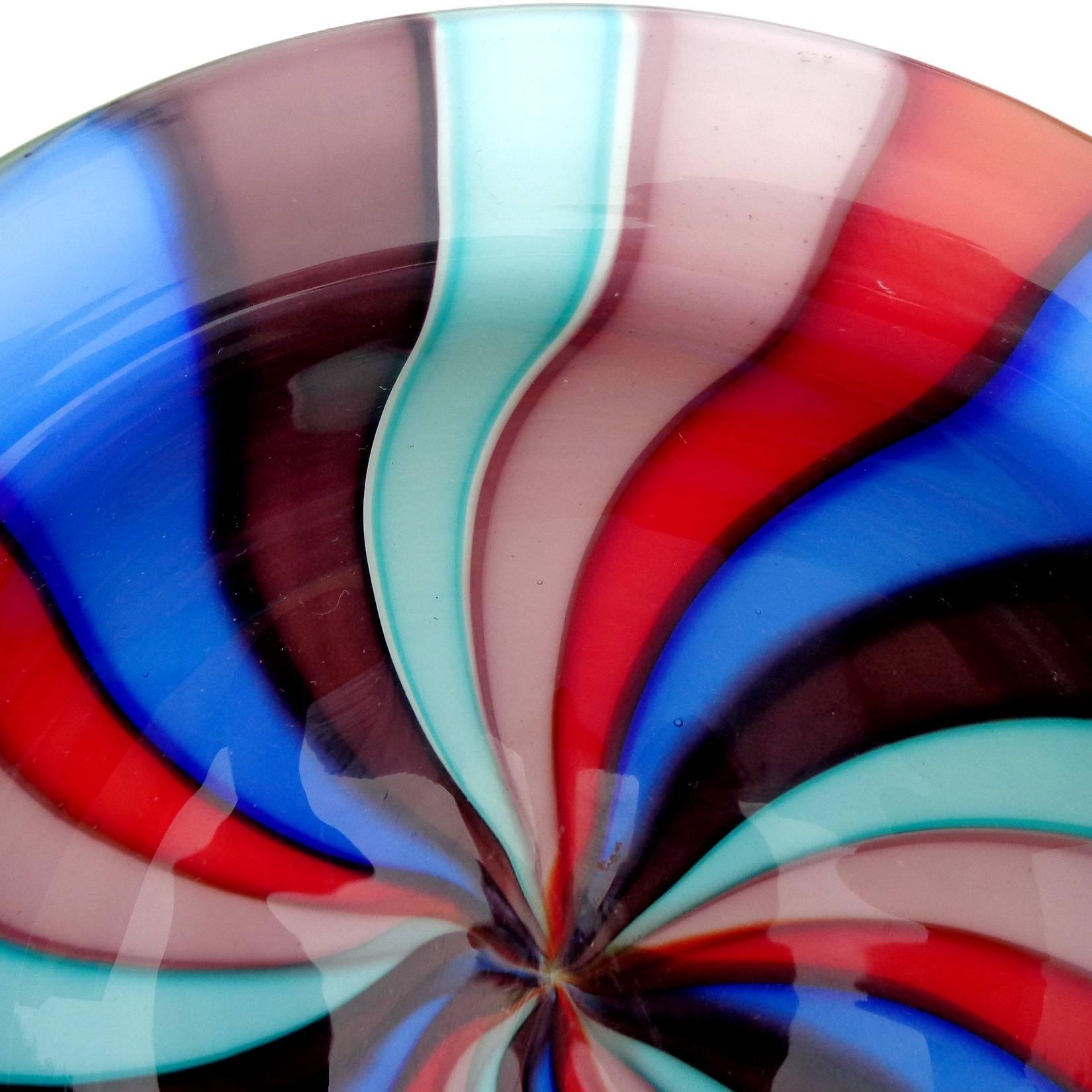 Beautiful vintage Murano hand blown teal, cobalt blue, dark purple, lavender, pink and red Italian art glass decorative bowl. Created in the manner of the Cenedese Company. The piece is thick and heavy, with outer white layer. Can be used as a