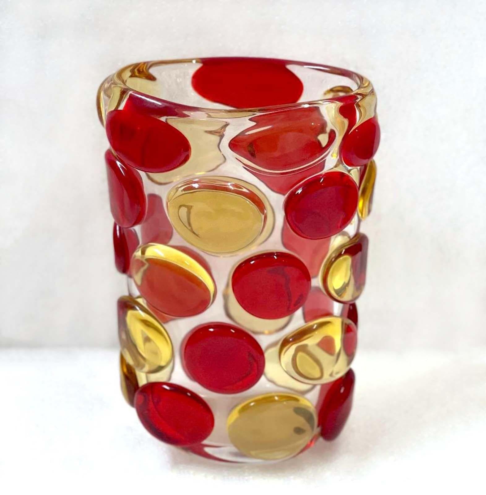 Beautiful vase with clear Murano glass body and decorative red and yellow Murano glass buttons by Camozzo and signed on the base. Made in Italy in the 1970s Measures: height: 13.5 inches / width: 9 inches / depth: 5.5 inches.