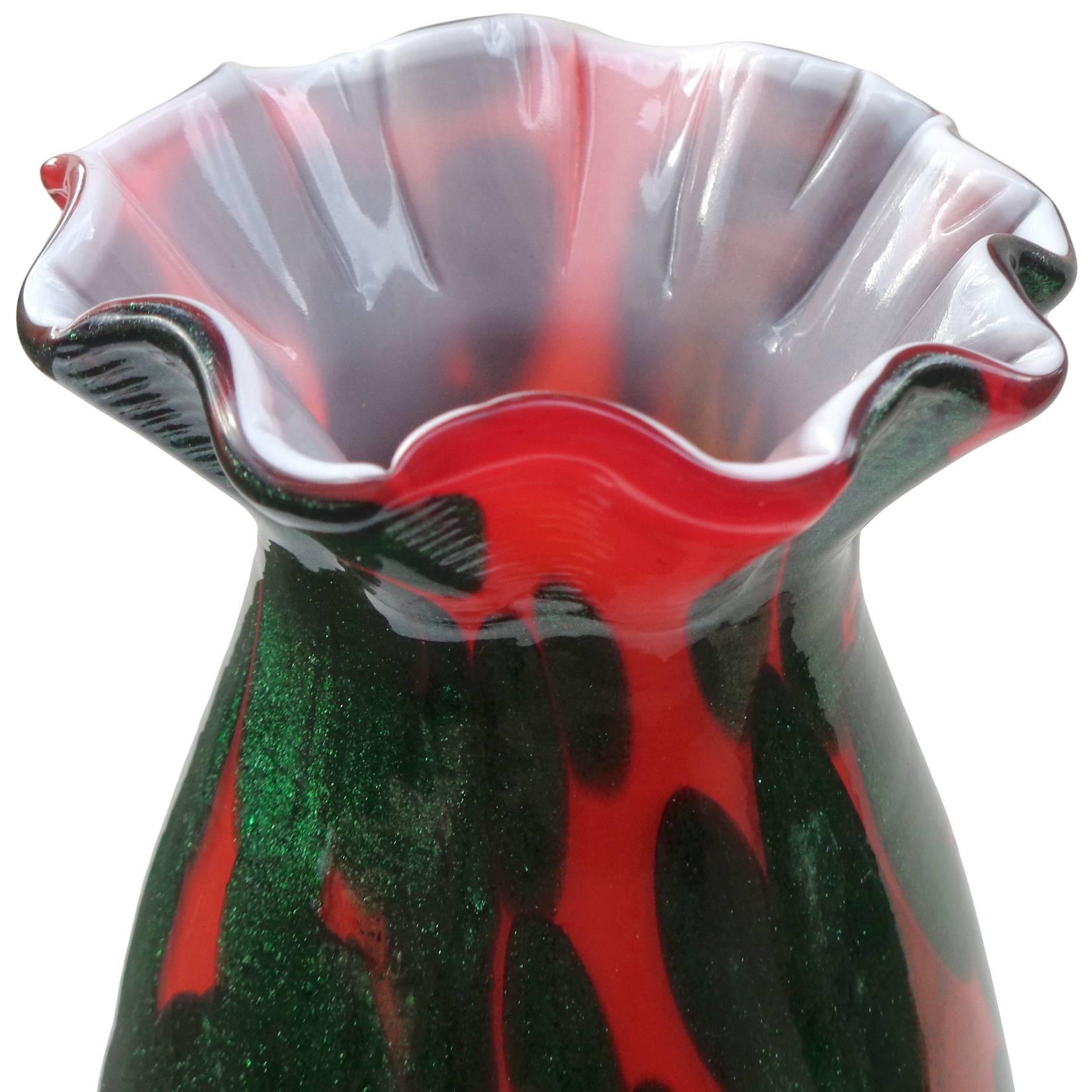 Gorgeous vintage Murano handblown green aventurine, red and white Italian art glass flower vase. Has a ruffled crimped rim. Shimmers in any light! Would be great to display at a desk or small side table. Retains original import gallery label.