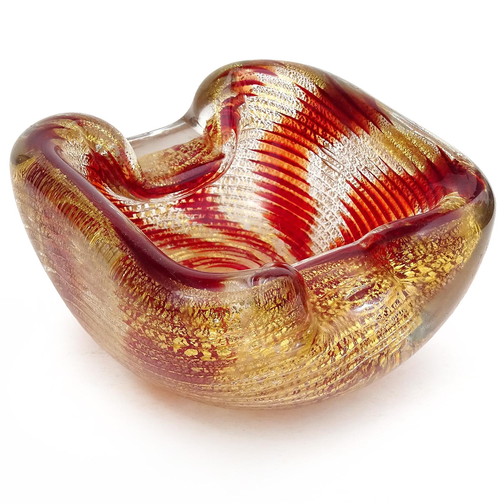Beautiful vintage Murano hand blown red and gold flecks Italian art glass sculptural chunky vide-poche, bowl or ashtray. Attributed to the Barovier e Toso company. The bowl has a a very unique striped pattern, and an optic design with swirling red