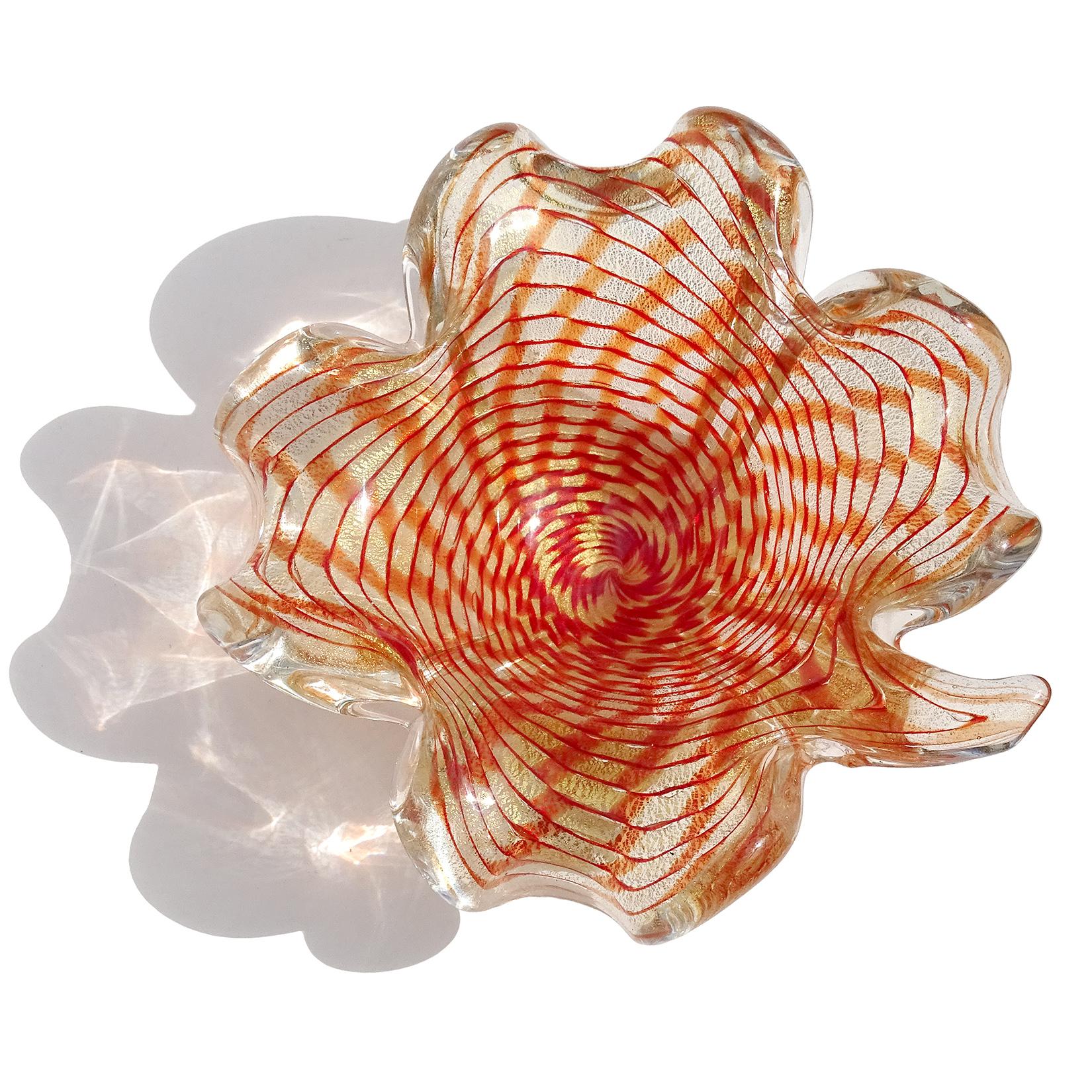 Beautiful Murano hand blown red orange and gold flecks Italian art glass leaf shaped bowl. Attributed to the Barovier e Toso Company. The design looks like a spiderweb. Profusely covered in gold leaf. Made with thick glass. Can be used as a display