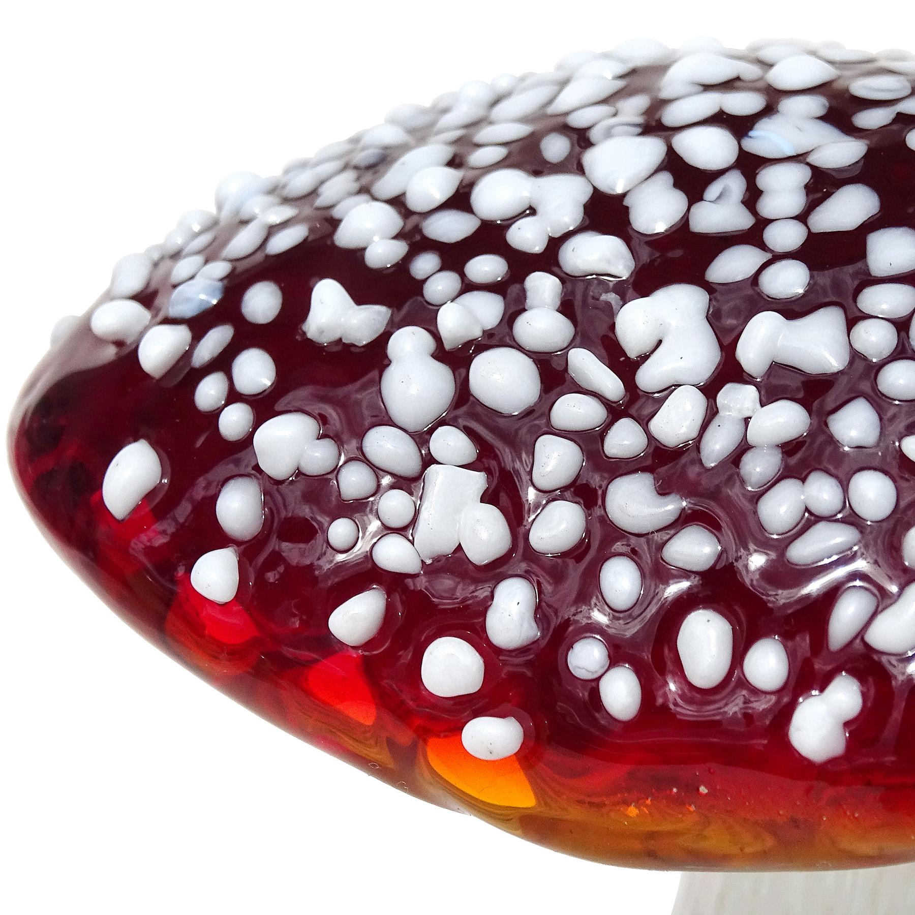 Beautiful and very unusual, vintage Murano hand blown deep red-orange and white spots Italian art glass mushroom / toadstool sculptural paperweight. The mushroom has been sculpted in a very realistic way. It could pass for a real mushroom. The stem
