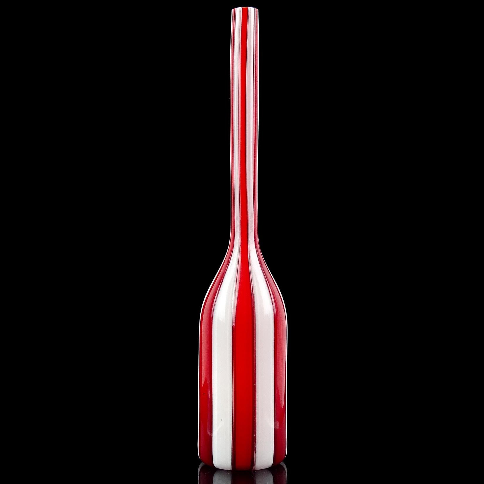 Beautiful vintage Murano hand blown red and white vertical stripes Italian art glass soliflore / specimen flower vase. The vase is very thin, with a long neck. It does not have a ribbed surface, but you can feel each cane piece. Created in the