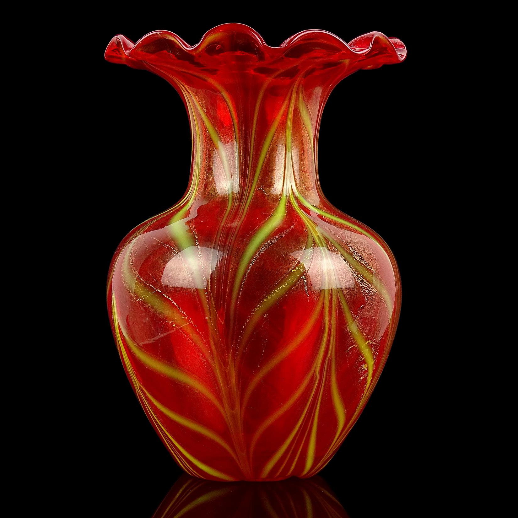 Beautiful vintage Murano hand blown red, yellow and gold flecks Italian art glass flower vase. Created in the style of Venetian glass and the Salviati company. Has a pulled feather or 