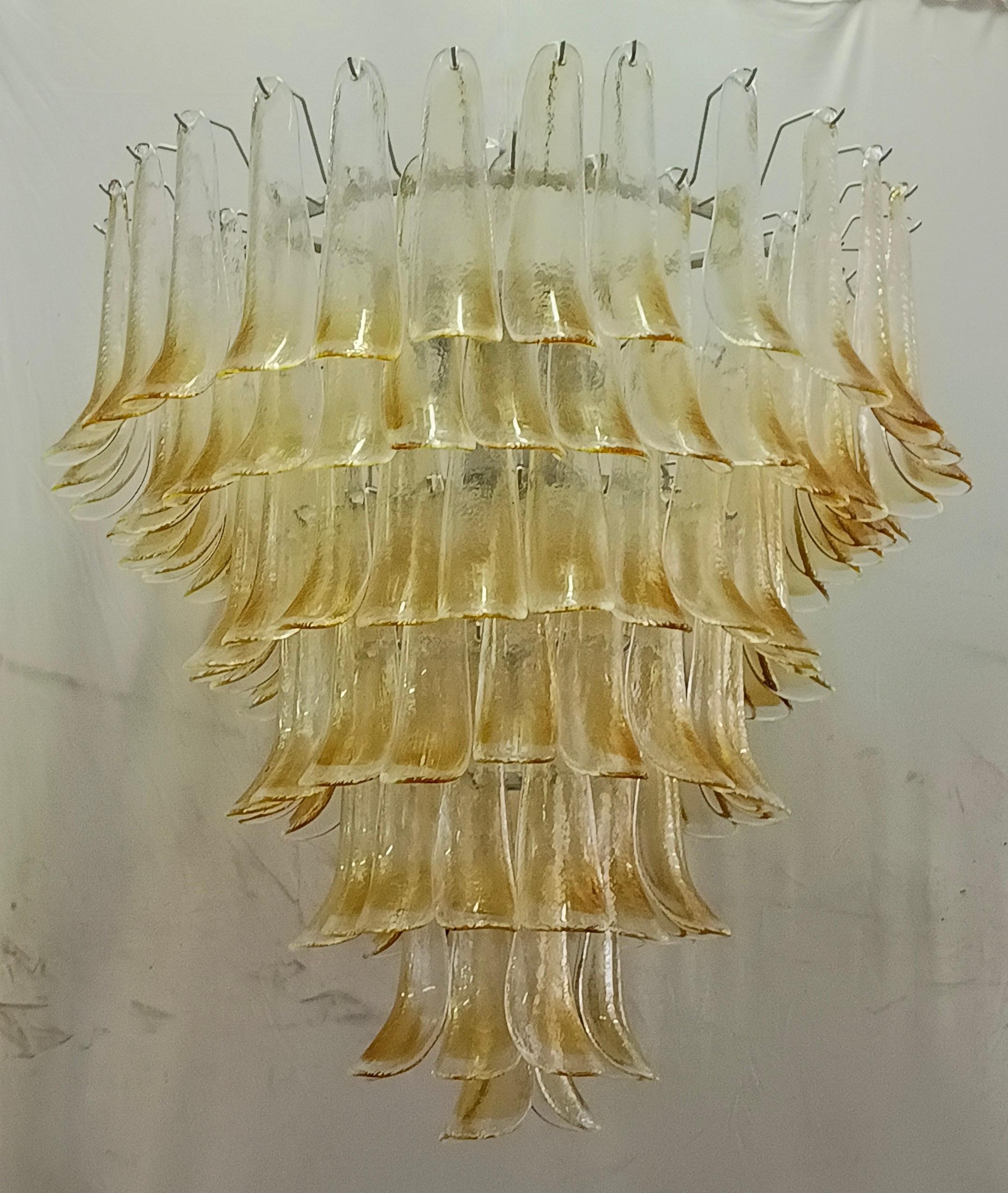 Extraordinary light ambra / transparent color for this Murano chandelier, a light ambra color with a unique transparency. Its ambra and transparent color is really guessed for a different and original chandelier from others. A beautiful stain of