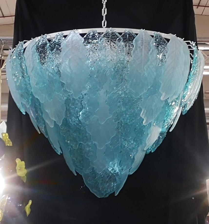 Fantastic Venetian sandblasted and light blu color for a Cascade of Murano leaves. A striking color for this chandelier.

All in Murano art glass with sandblasted and light blu leaves placed all around, positioned alternately. The color of this very