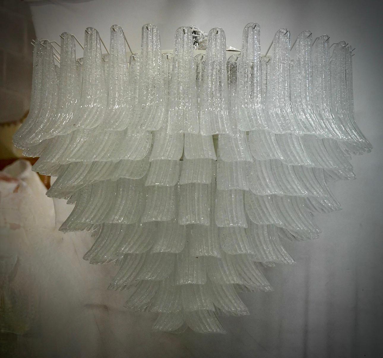 Extraordinary transparent color for this Murano chandelier, a strong white transparent color with a unique transparency. Its transparent color is really guessed for a different and original chandelier from others. A beautiful stain of color above