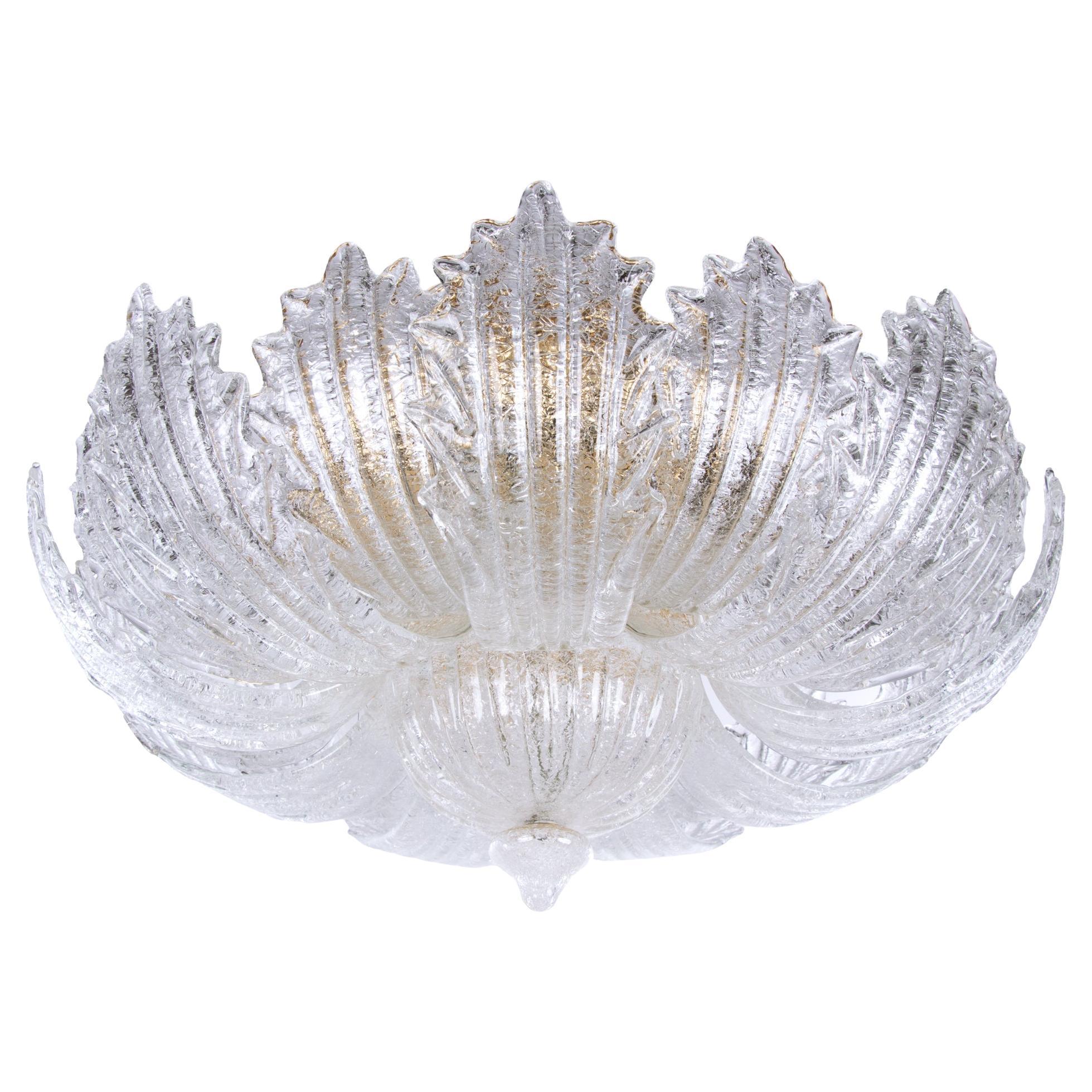 Extremely elegant Murano flush mount ceiling light with 18 textured Murano glass petals and one bowl on a golden brass frame. An elegant floral chandelier made of hand-blown Murano glass in “Rugiada” technique. Heavy duty. Has 15 sockets. In very