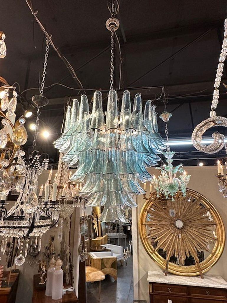 Modern Murano saddle glass waterfall chandelier in Fontana Green. Circa 2000. The chandelier has been professionally rewired, comes with matching chain and canopy. It is ready to hang!
