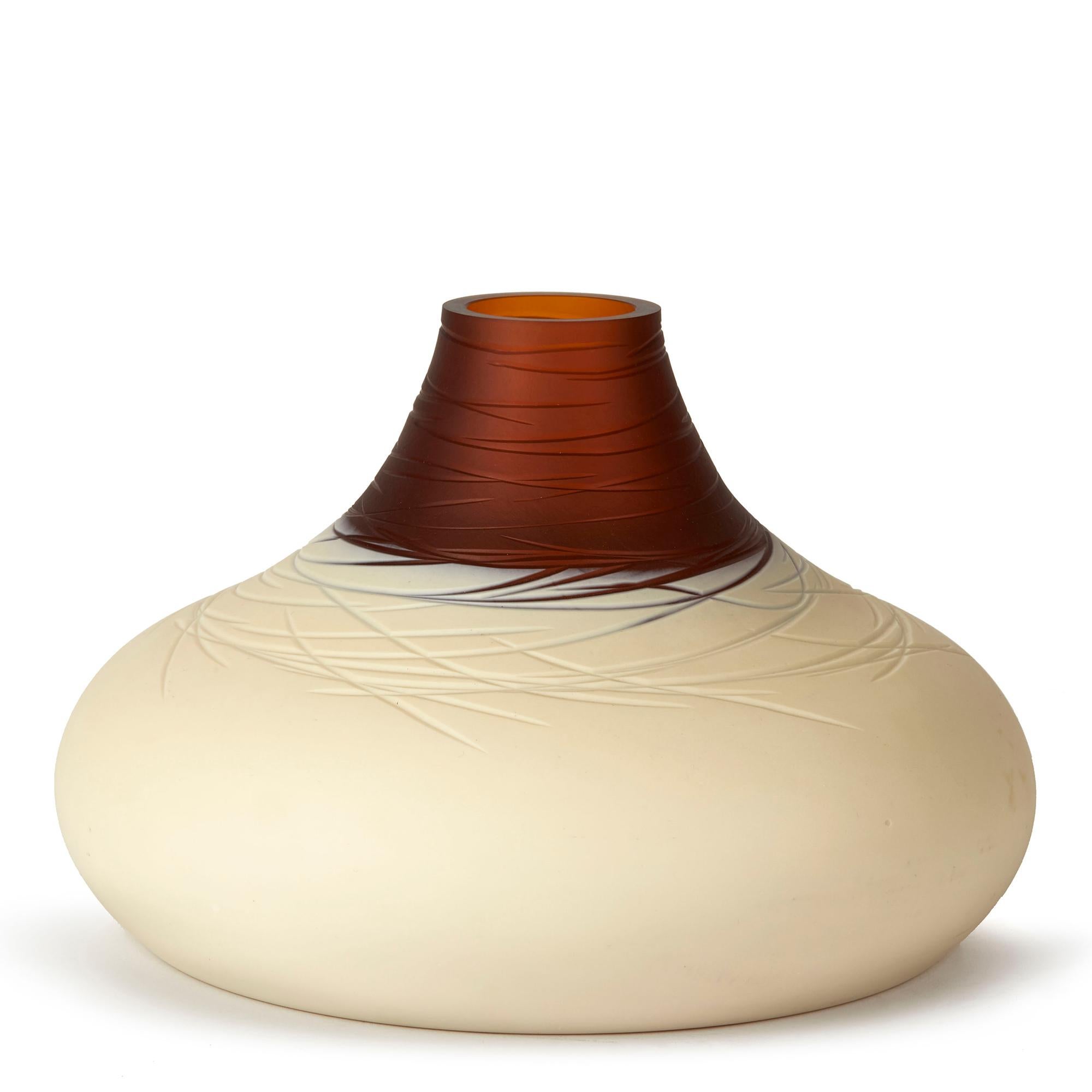 A stunning Italian Caramello art glass vase designed by Luca Nichetto for Salviati glass, Murano. The vase is heavily made and of wide squat rounded shape with incised trailed patterning to the upper body and neck. The vase has a short funnel shaped