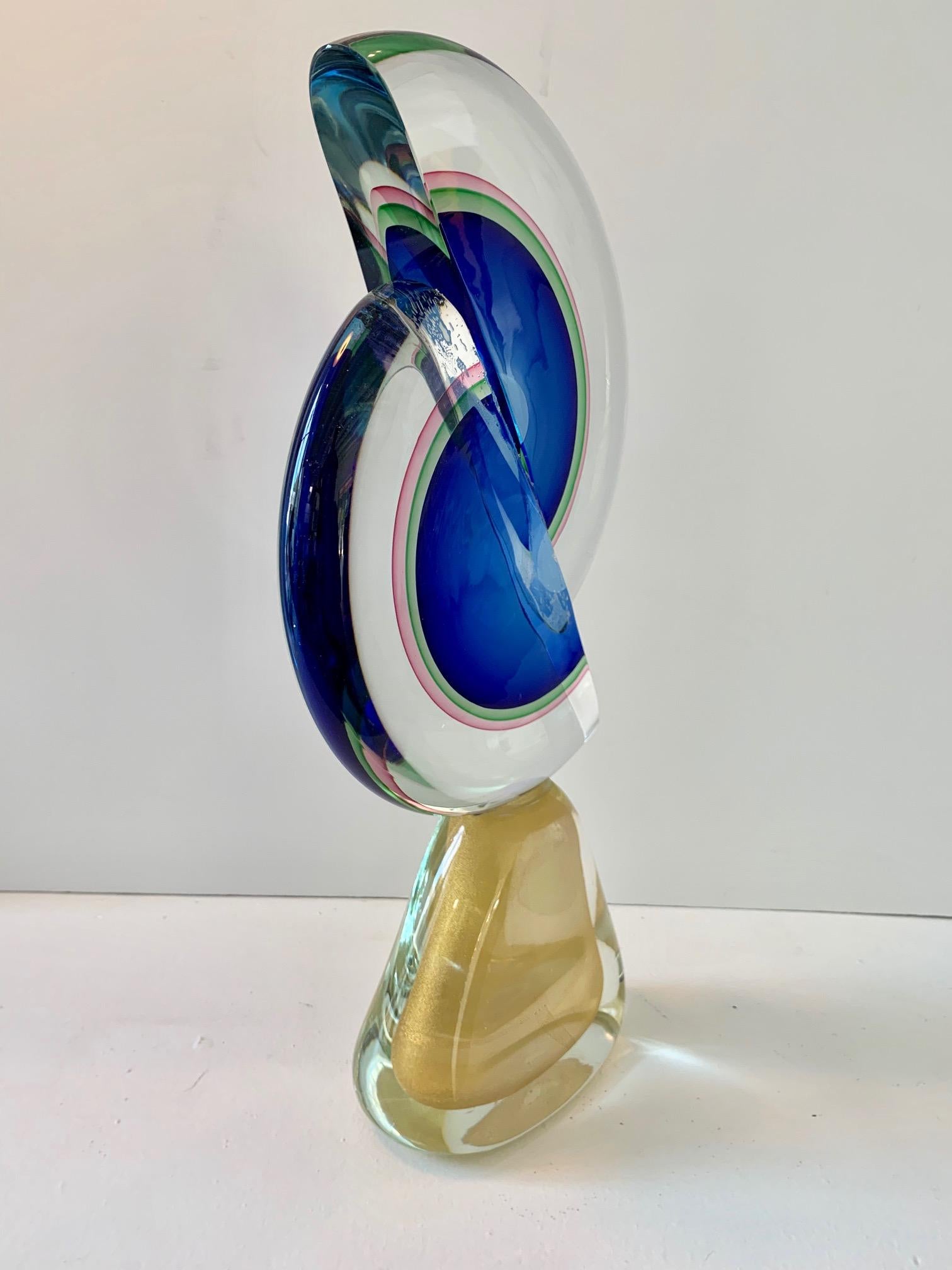 Large and spectacular Sommerso Murano sculpture. Very vibrant color with gold attached base.