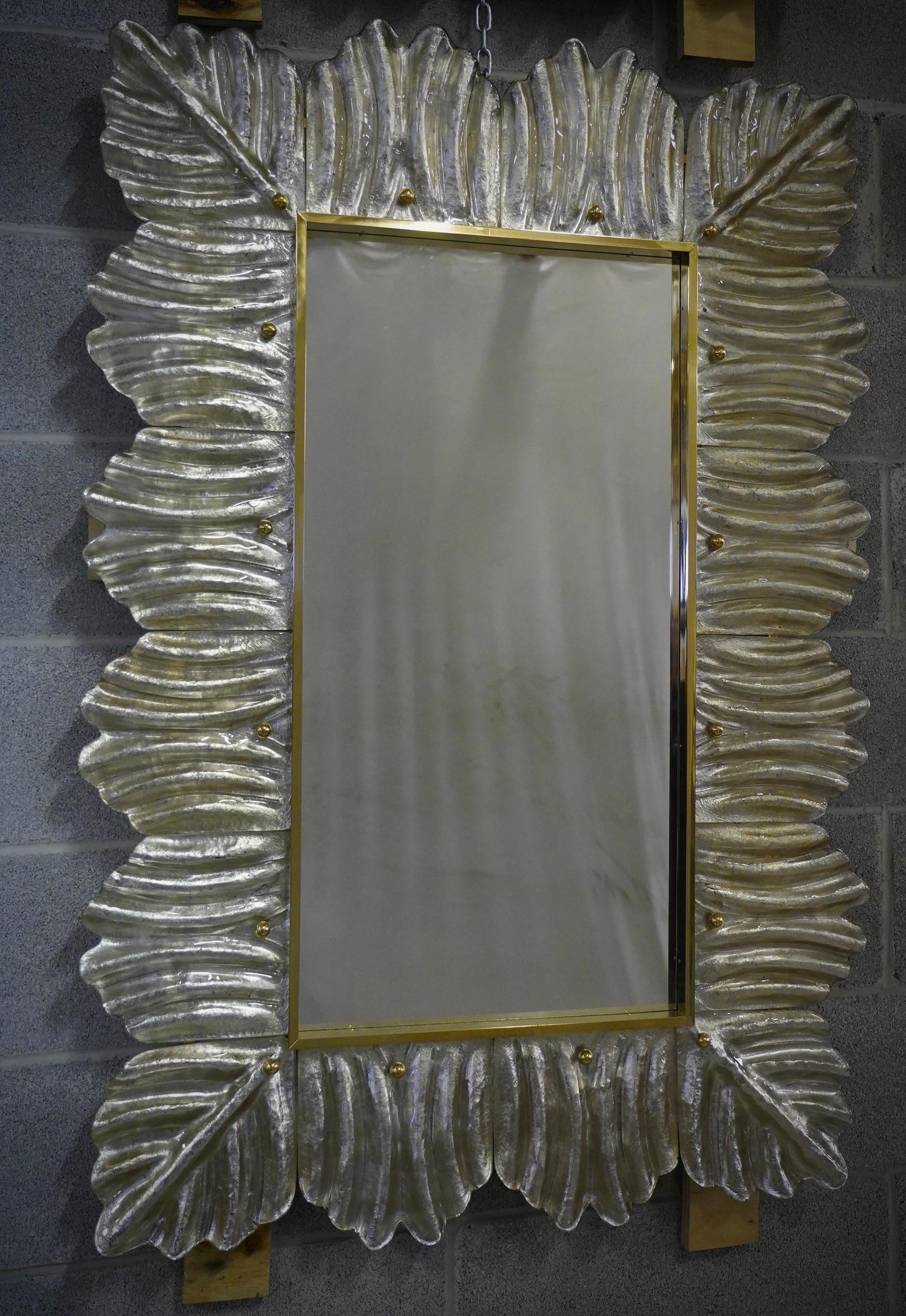 A silver color frame, reach the eye of the beholder, leaving him entranced; of Murano blu art glass wall mirror. Beautifully shaped and of excellent size, the wall mirror is a real design object.

The structure of the wall mirror is in wood, where