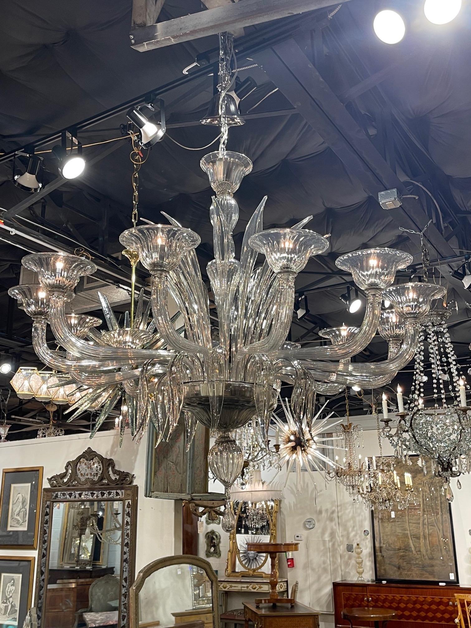 Decorative smoke colored murano glass chandelier with 12 lights. A very special fixture that creates a high end look!