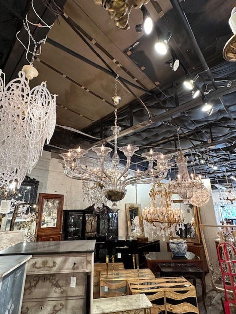 Gorgeous large scale Murano smoke glass 16 light chandelier. Circa 2000. The chandelier has been professionally rewired, comes with matching chain and canopy. It is ready to hang!