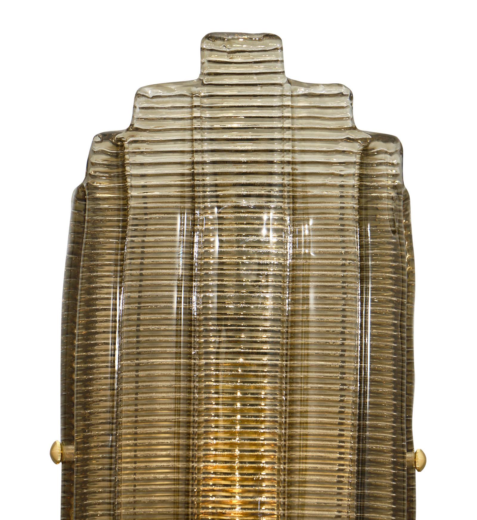 Pair of Italian smoked Murano glass ridged sconces all hand-blown. Each sconce is made of many ridged blades fused to create this important design. The hardware is brass. They have been newly wired to fit US standards.

This pair is a special order