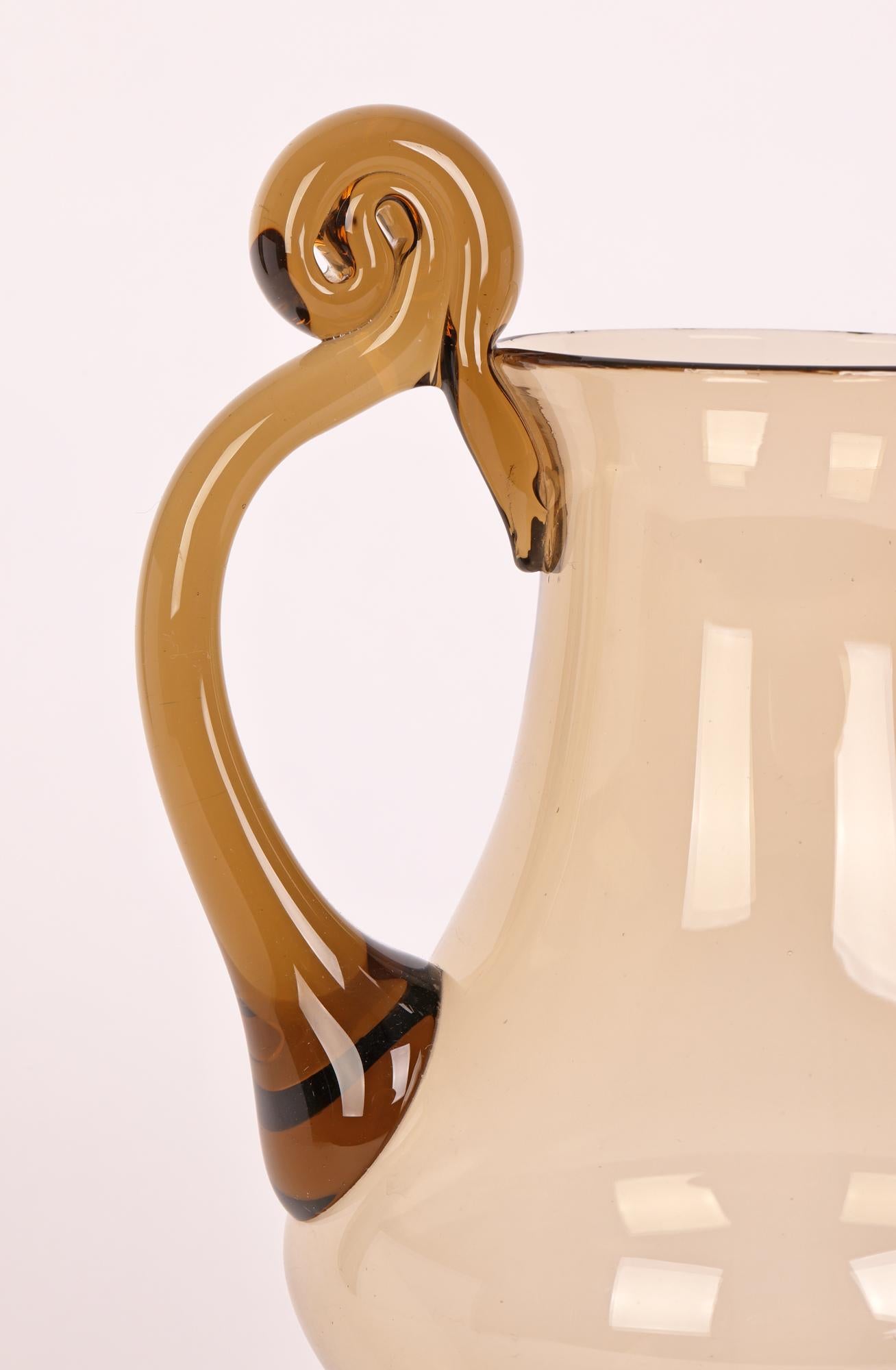 A very fine and elegant vintage Italian Murano Soffiato brown tinted glass handled jug attributed to MVM Cappellin dating between 1930 and 1950. Typical in style and design of the work of renowned artist Vittorio Zecchin (Italian, 1878 – 1947) the