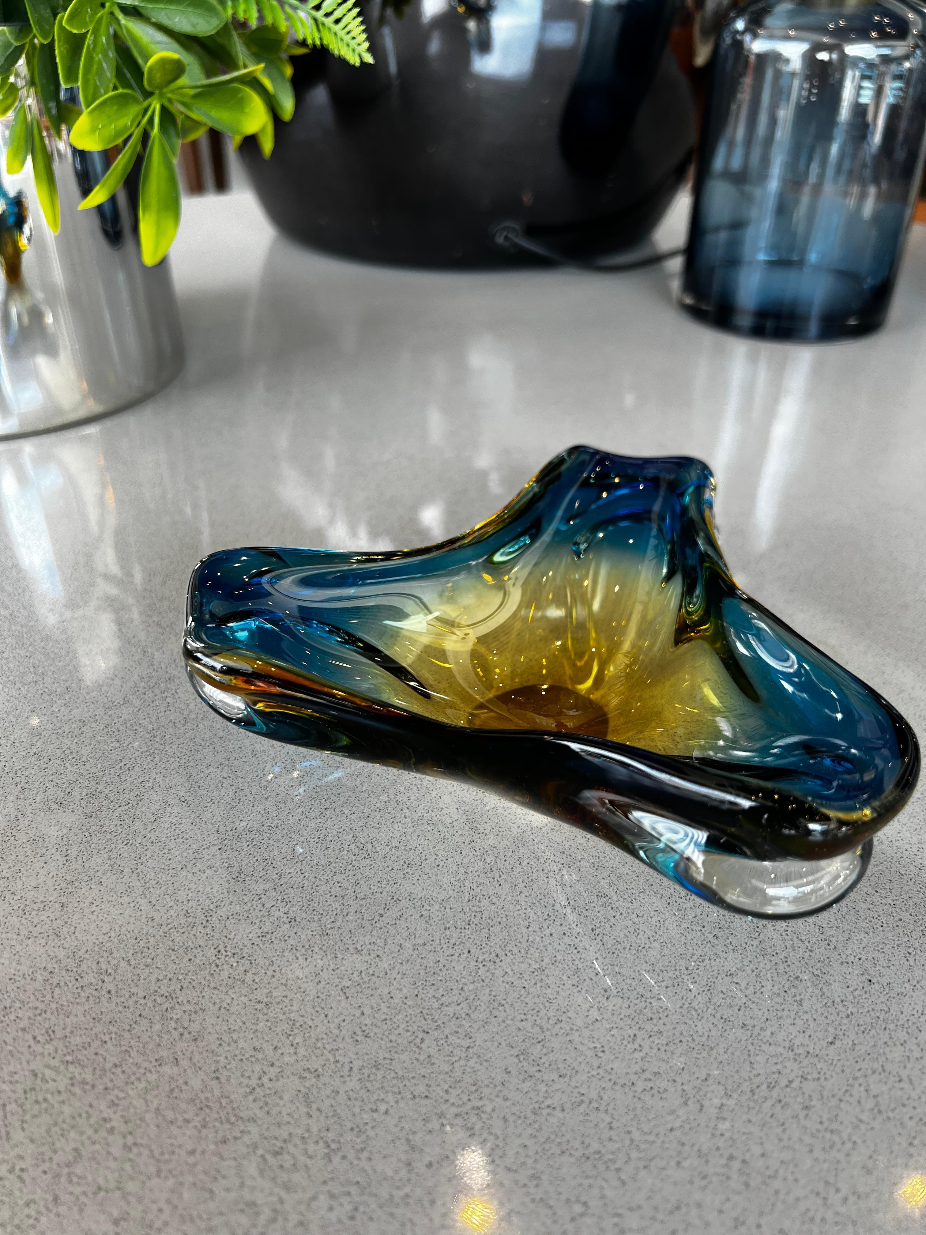 Handblown art glass ashtray or trinket dish made in Murano, Italy. Featuring a unique irregular triangle shape this piece was made using the 
