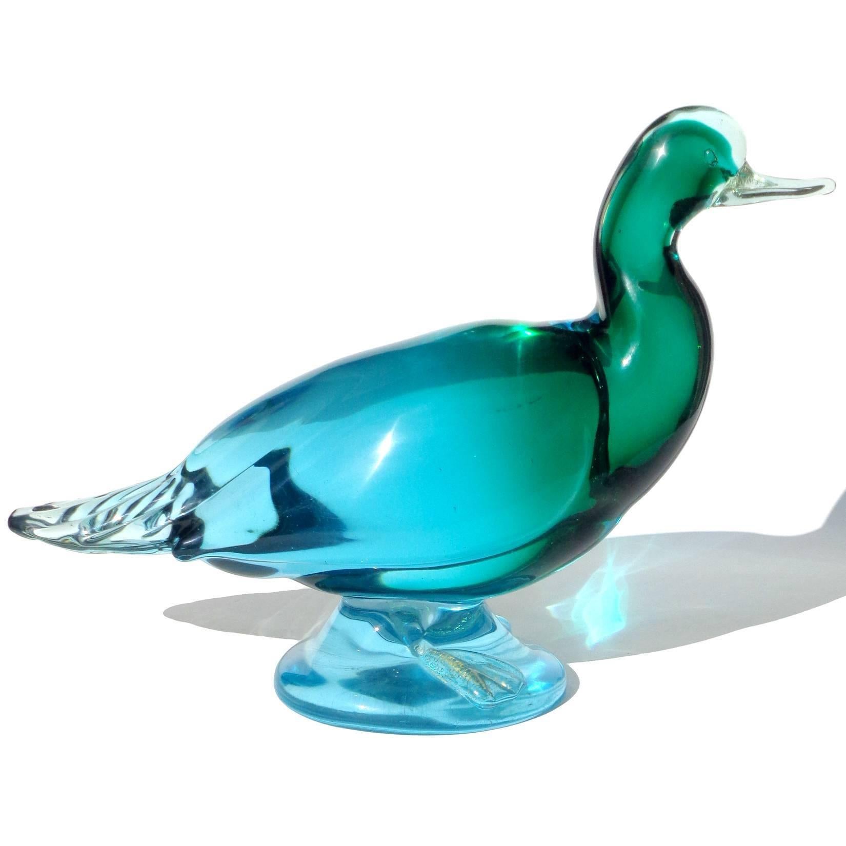 Beautiful and very large, vintage Murano hand blown Sommerso blue and green with gold flecks accents, art glass duck sculpture. Can be used as a centerpiece on any table. Mid-century era. Very heavy piece, and measures 12