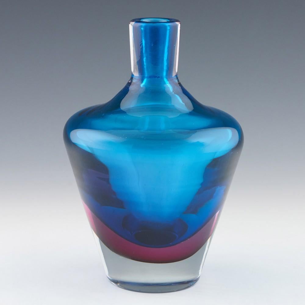 Murano Sommerso Decanter, c1965

Additional information:
Date : c1965 
Origin : Murano, Italy 
Bowl Features : Turquoise, cranberry and clear sommerso glass. Shouldered bottle shape. Elongated stopper. The design is strongly reminiscent of Flavio