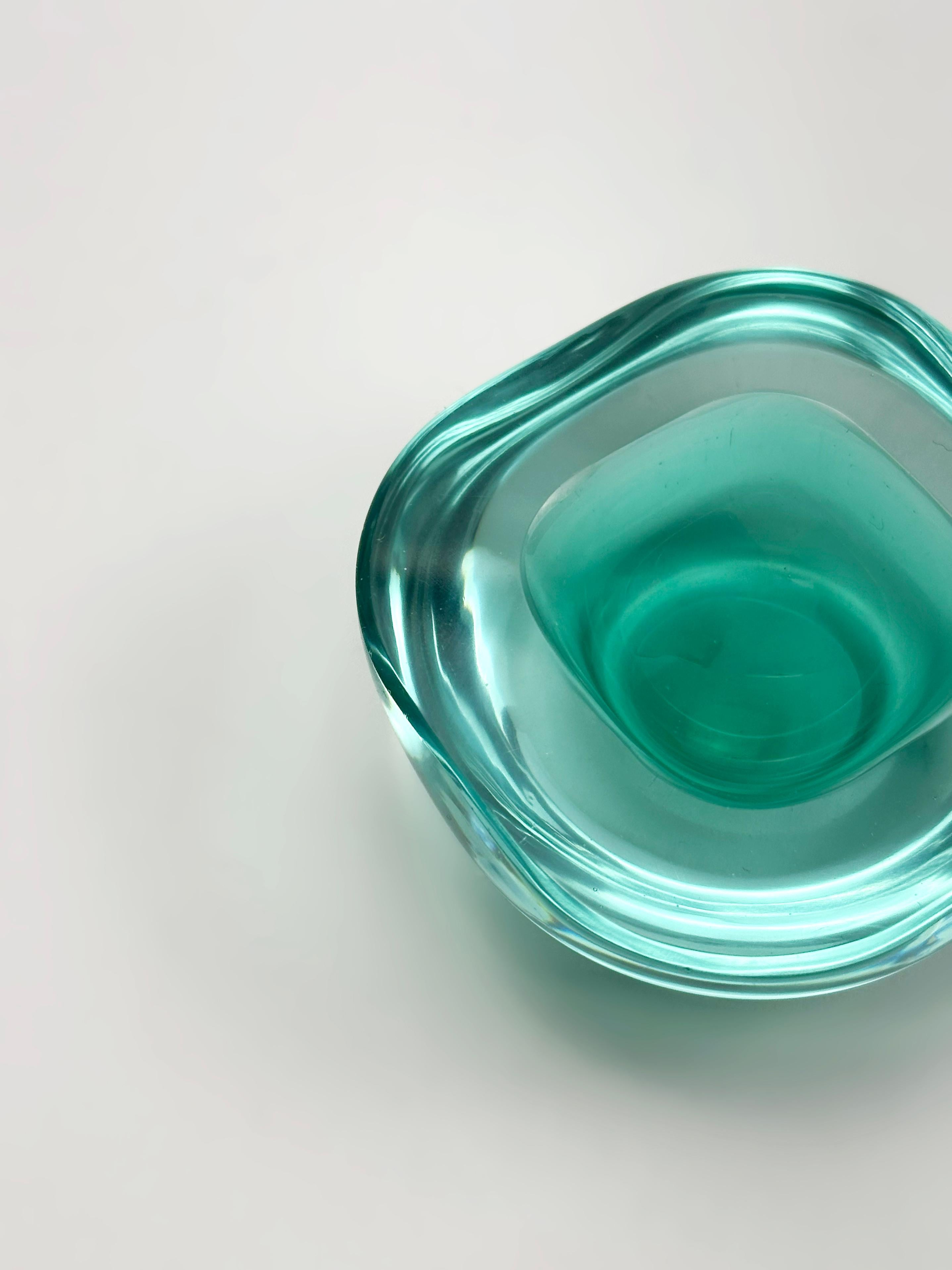 A Murano glass geode bowl by Archimede Seguso, made in Italy circa 1960s, utilising the sommerso technique. This square-form mid-century decorative bowl features a luminous core of mint green glass encased in a layer of transparent pale blue,