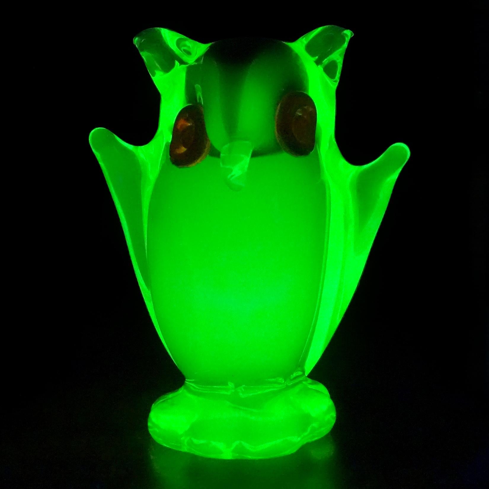 Beautiful and cute, vintage Murano hand blown Sommerso bright yellow-green with inner olive green head, Italian art glass owl figurine sculpture. It has red applies eyes and stands on small attached base. The piece is made with Uranium 