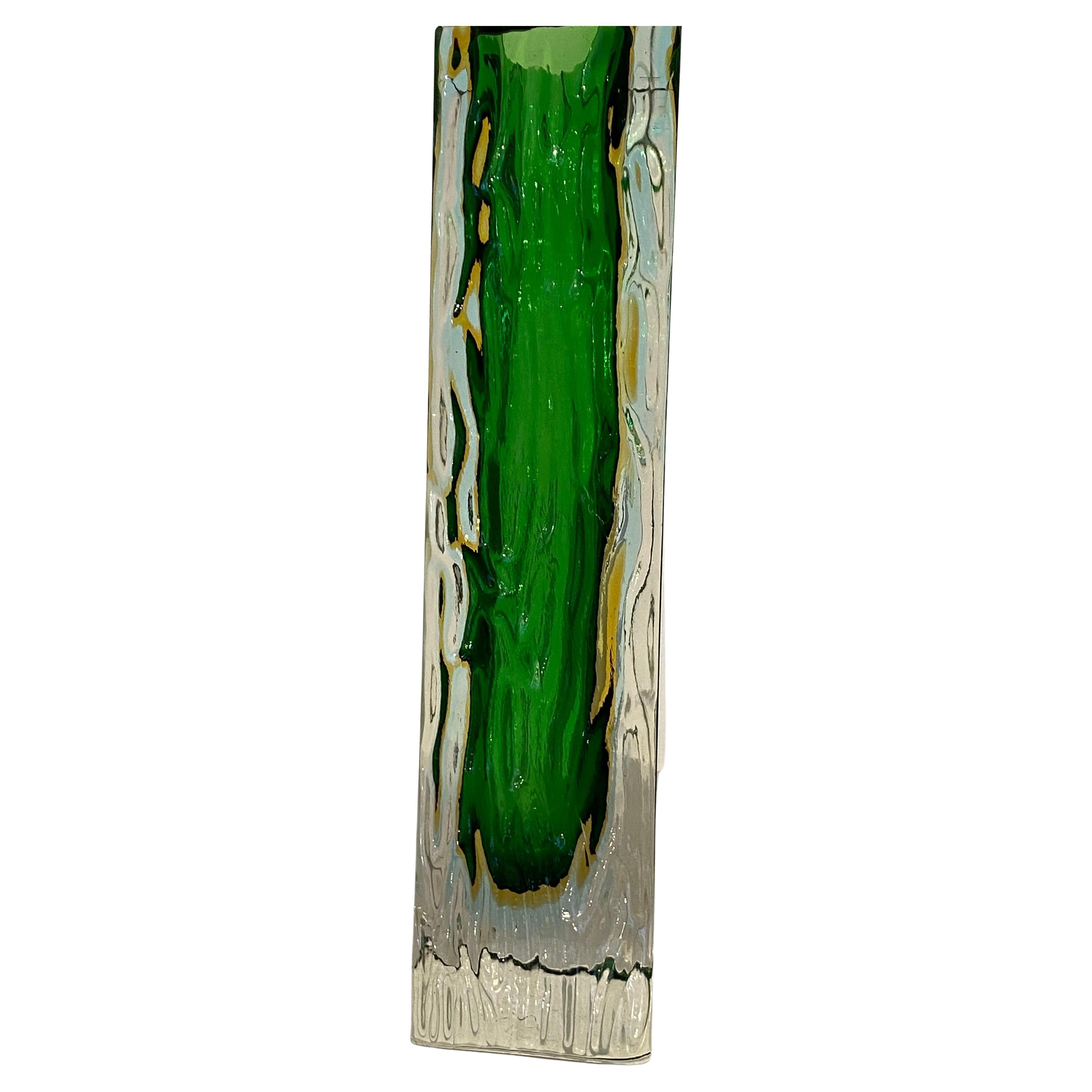 Beautifully elegant designed by Allesandro Mandurzatto and made in Murano Italy a table vase designed of artistically shaped textured sides and faceted edges, the contrasting colors of green and yellow are fused into the clear glass shape using the