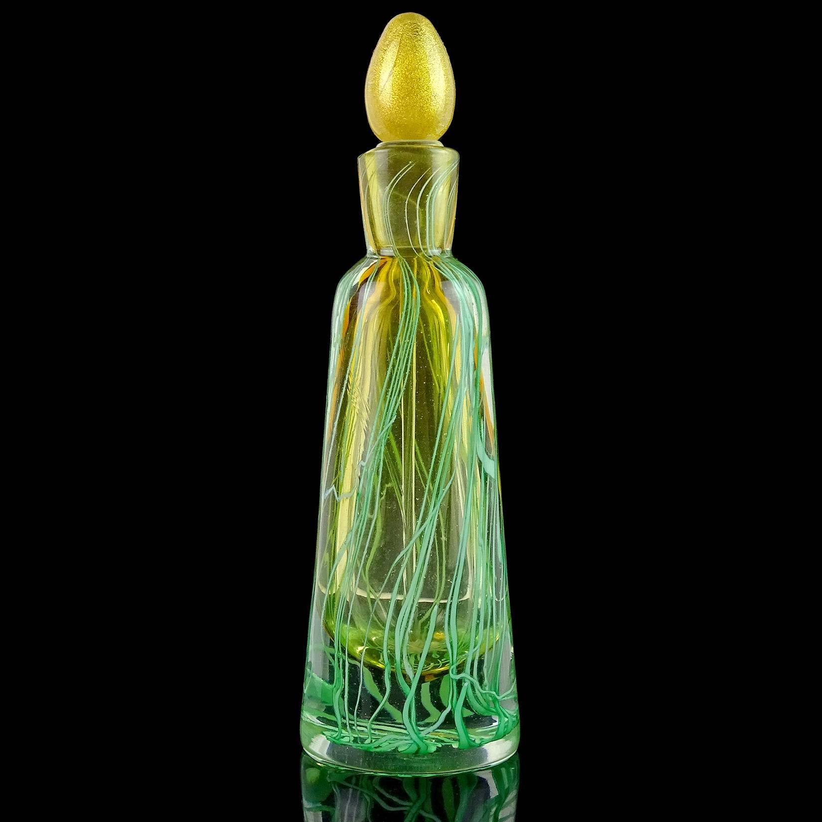 Beautiful Murano hand blown Sommerso orange, light green ribbons and gold flecks Italian art glass perfume bottle. Documented to the Fratelli Toso Company. Still retains an intact dauber topped in gold leaf. Would look perfect on any vanity or side